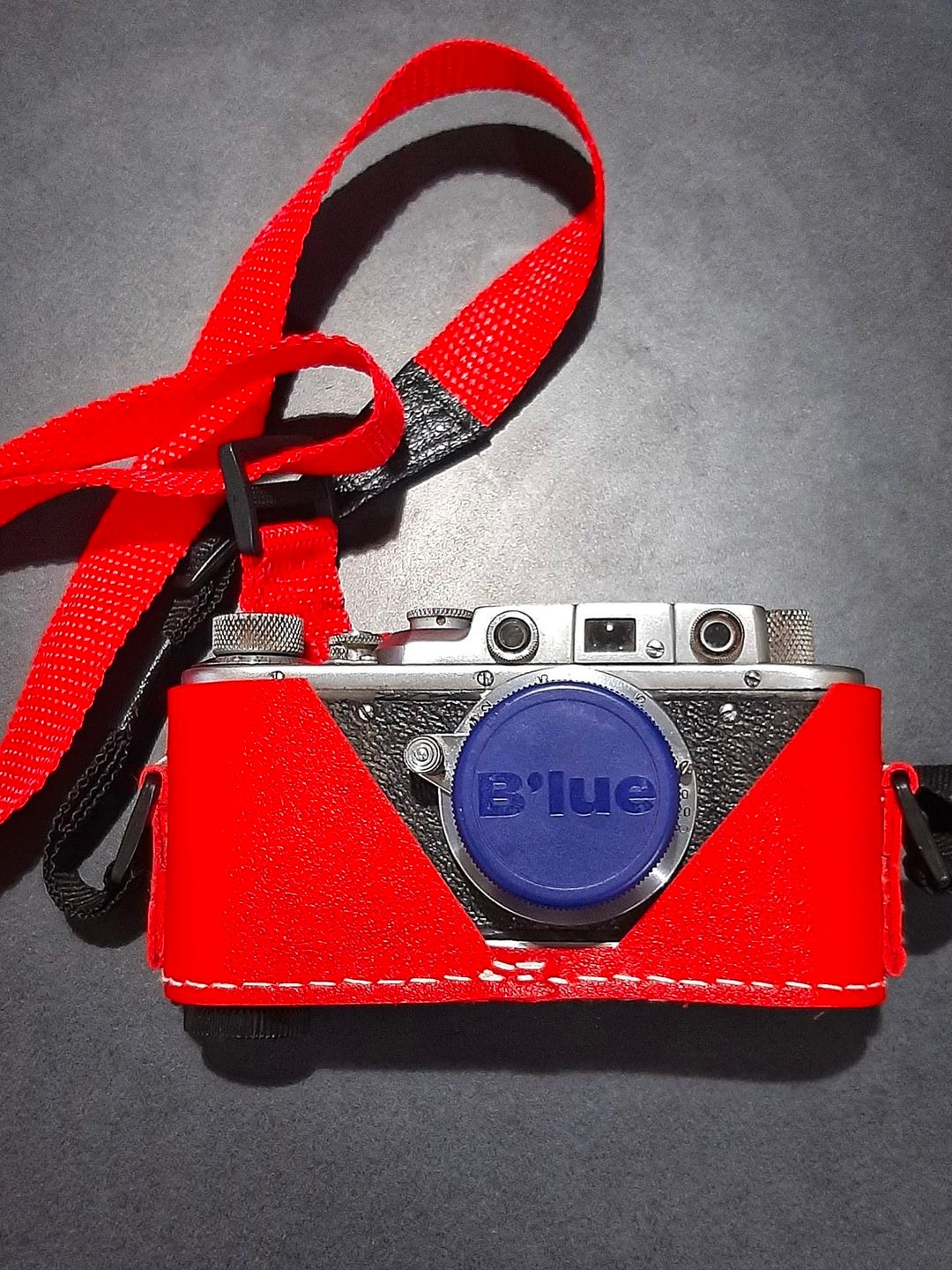 My DIY red Zorki half case, with repurposed lens cap.