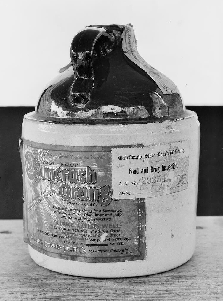 1950's drawing of (Santa Claus) holding a fruit crate of Sunkist