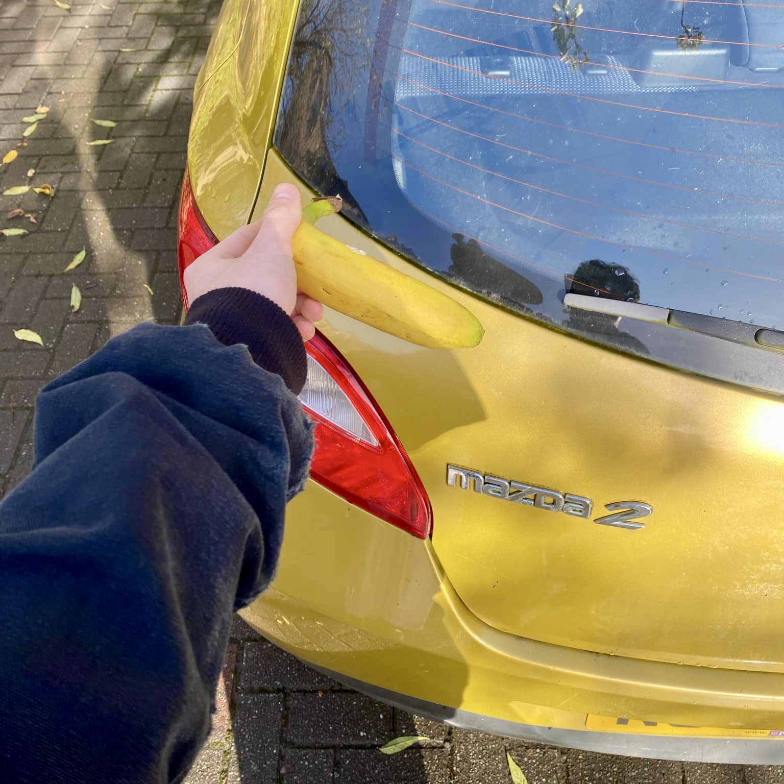 The paint code for my son's 2007 Mazda-2 is 35Y. Banana for