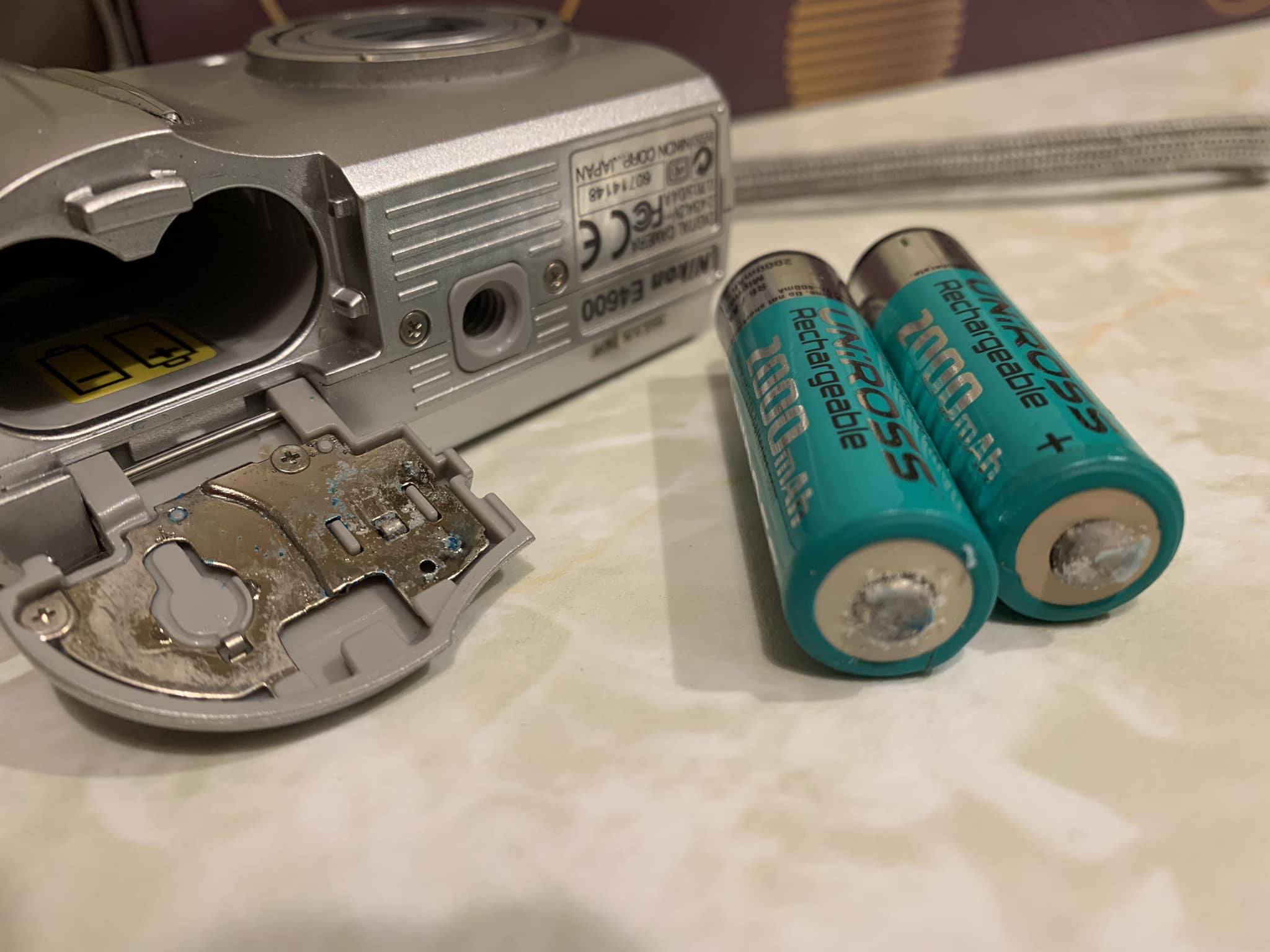Tips on removing corroded camera battery