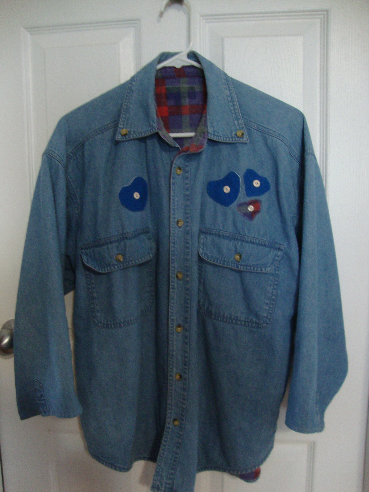 Upcycling denim jacket with appliques to cover burn holes