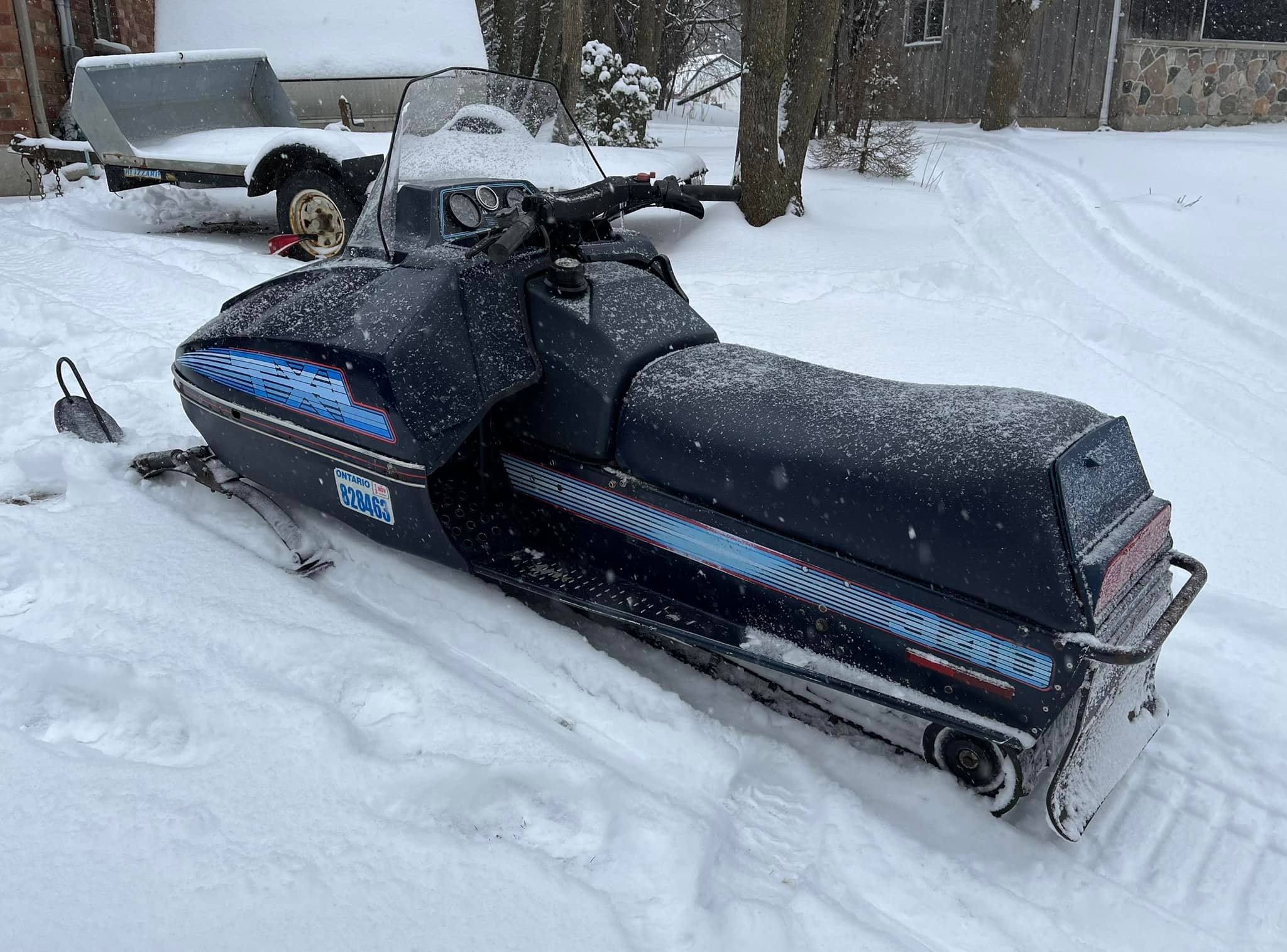 Riding vintage Polaris TX-L in deep snow