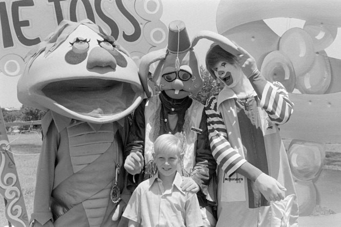 The Portal - This photo shows a young boy posing with three costumed ...