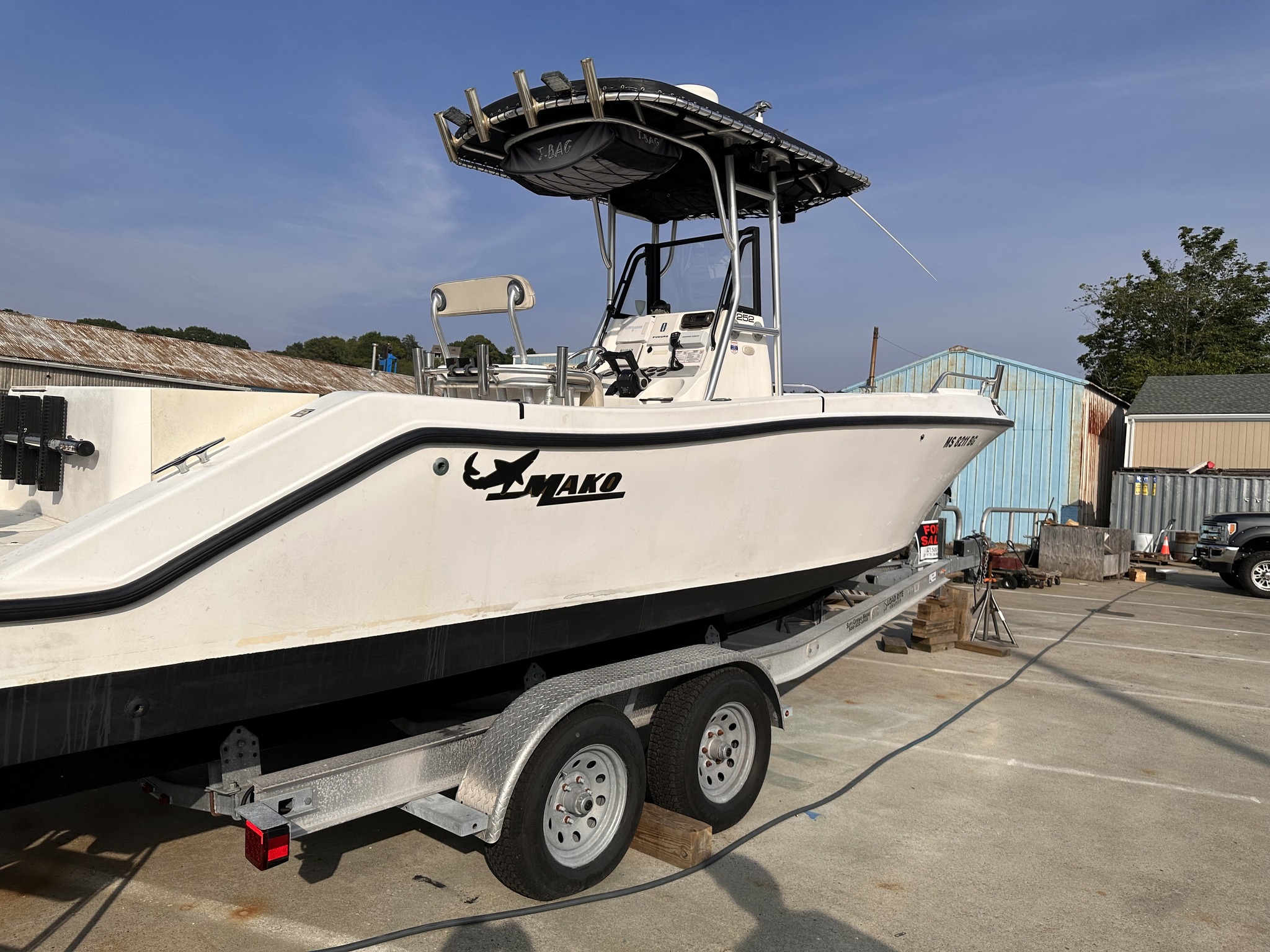 center console macerator fish box Clam 2841 Trap Contains multiple storage compartments and cup holders Durable polyethylene construction Fits most Clam Fish Trap flip 2026 Hurricane Center Console 24