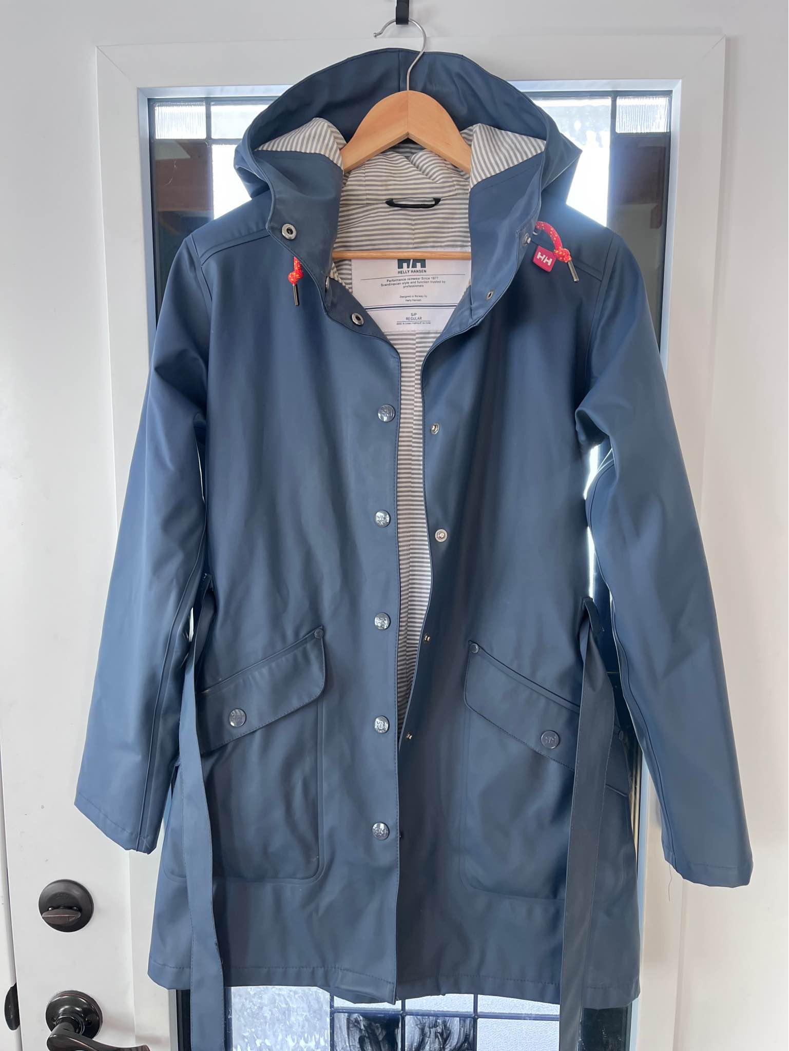 Navy Helly Hansen Rain Jacket with striped lining. Women