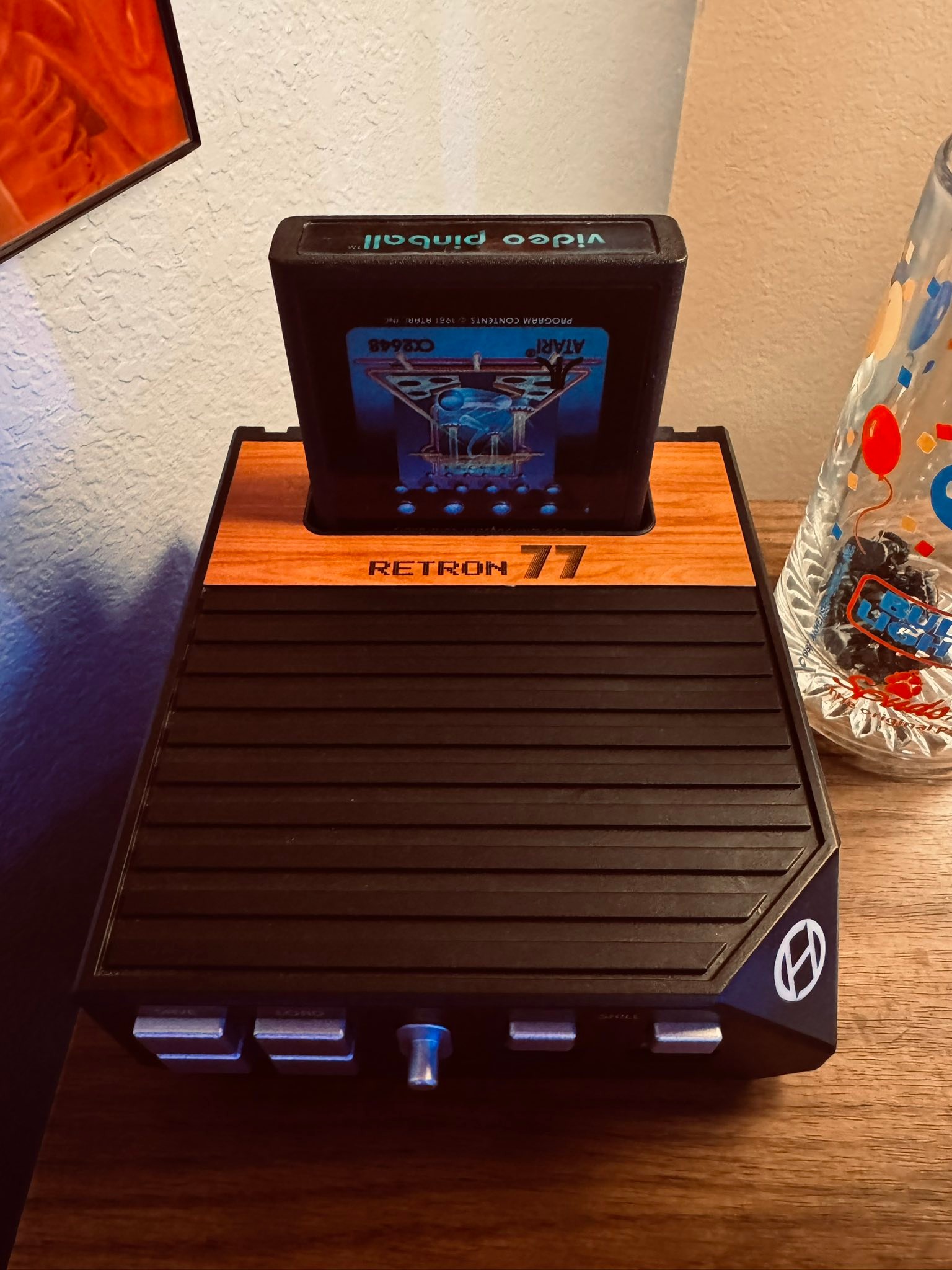 Retro home office with Hyperkin Retron 77 and Atari 2600 games