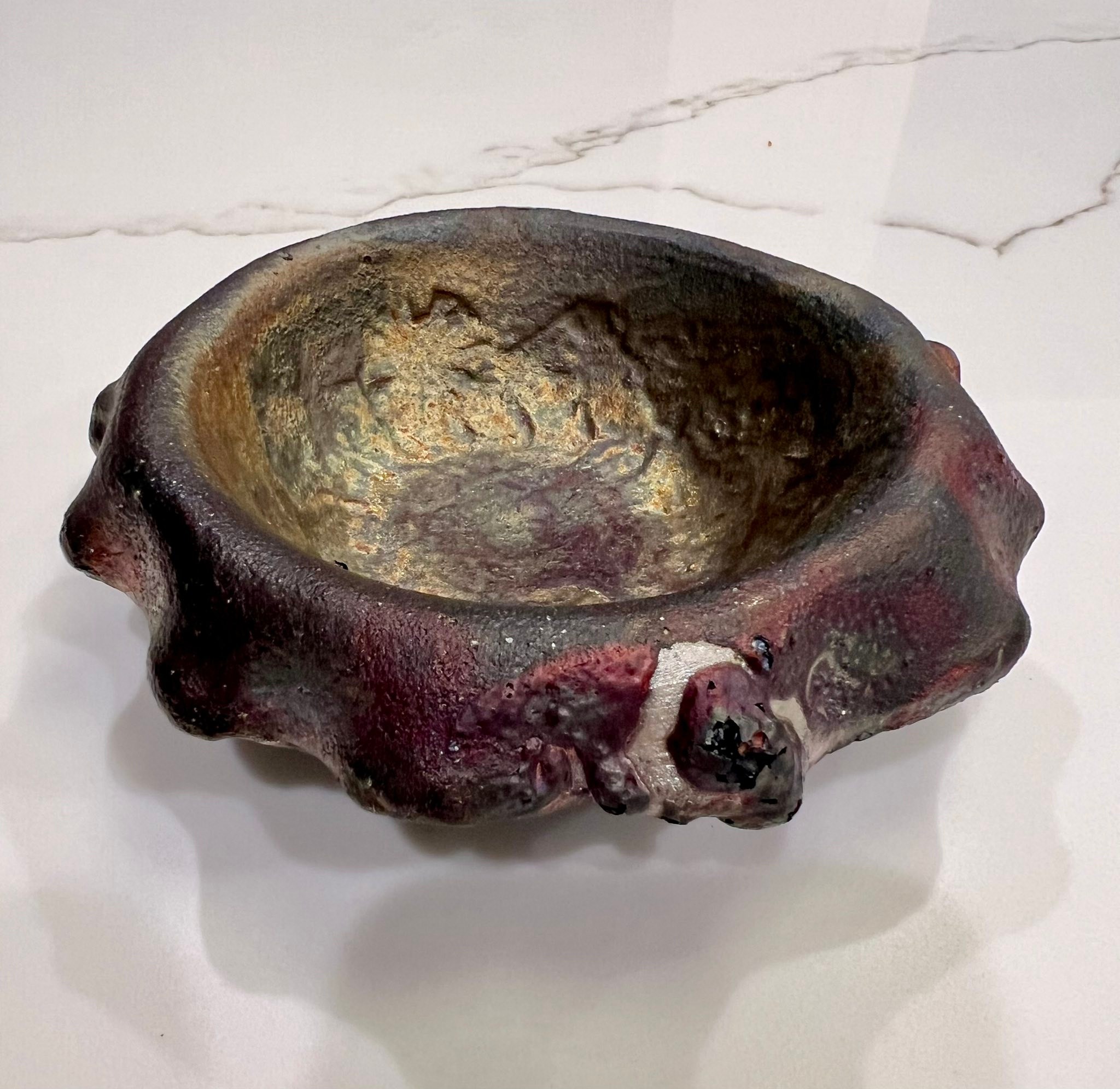 What is the maker's mark on this raku piece?