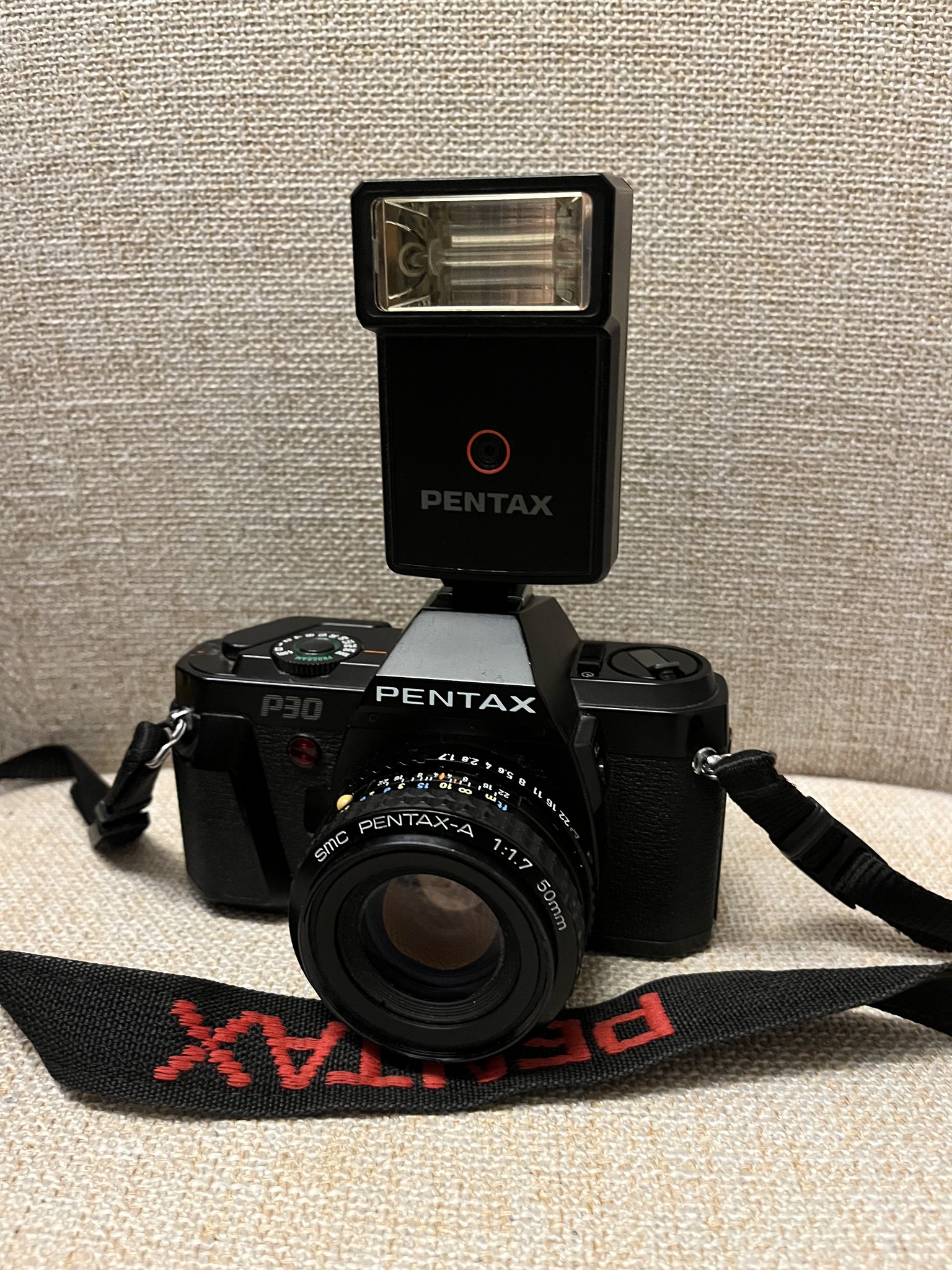 Vintage Pentax P30 camera with SMC 50mm lens and AF160SA flash