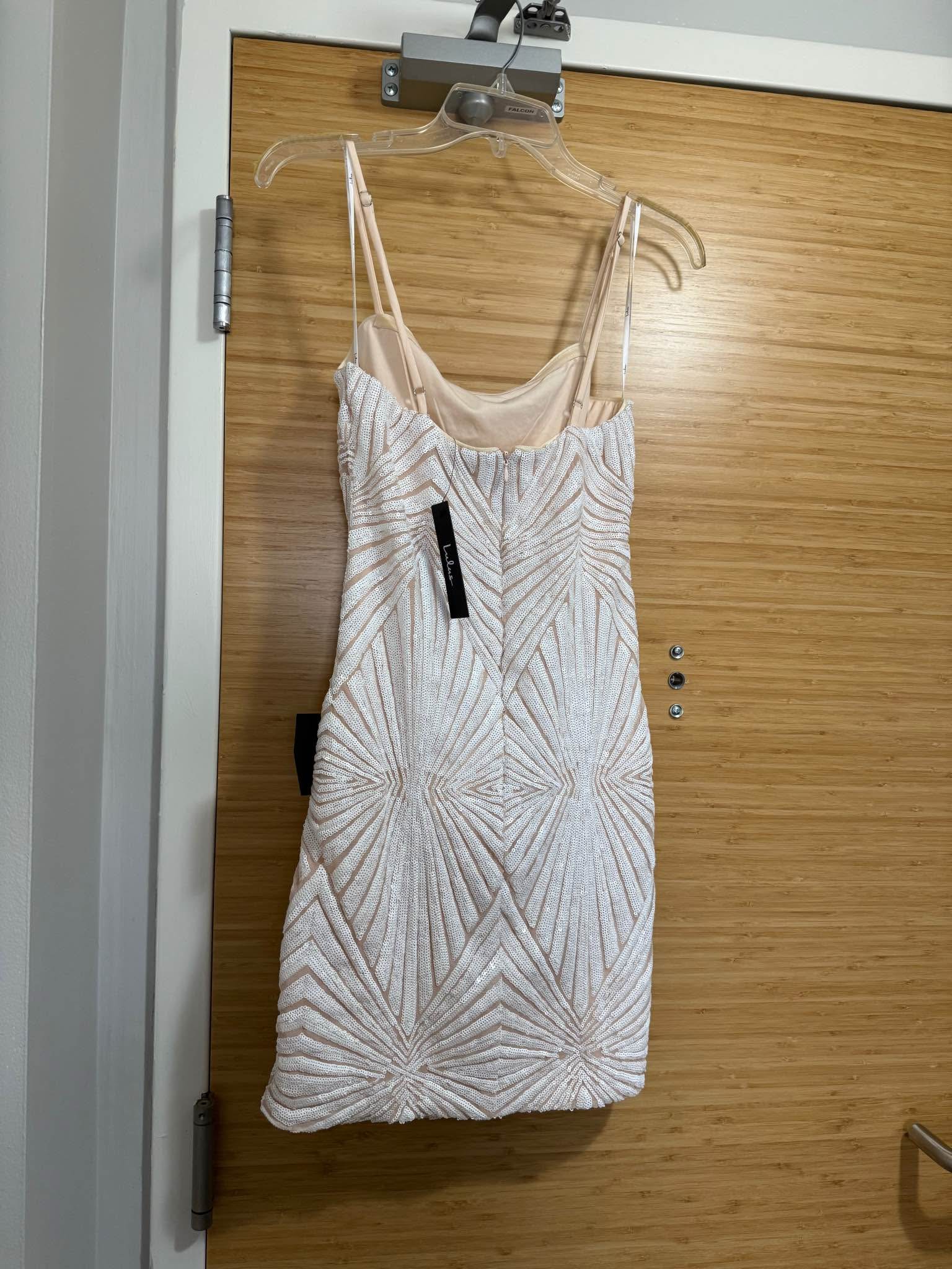 New with tags, size large Lulus “lost in your eyes white sequin bodycon mini dress.” Currently retails for $59. Went with another option. Size large, fits more like a medium IMO