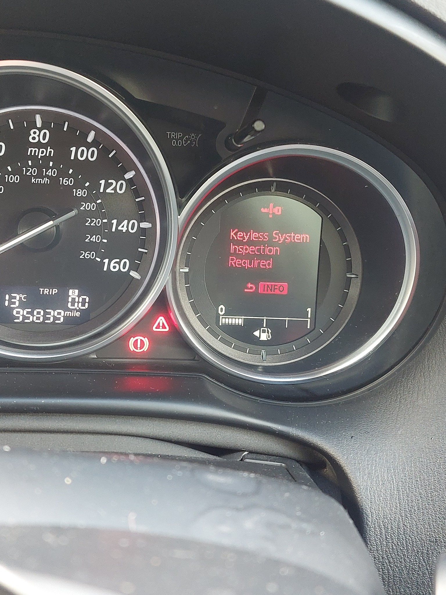 What causes keyless system inspection required warning on Mazda CX-5?