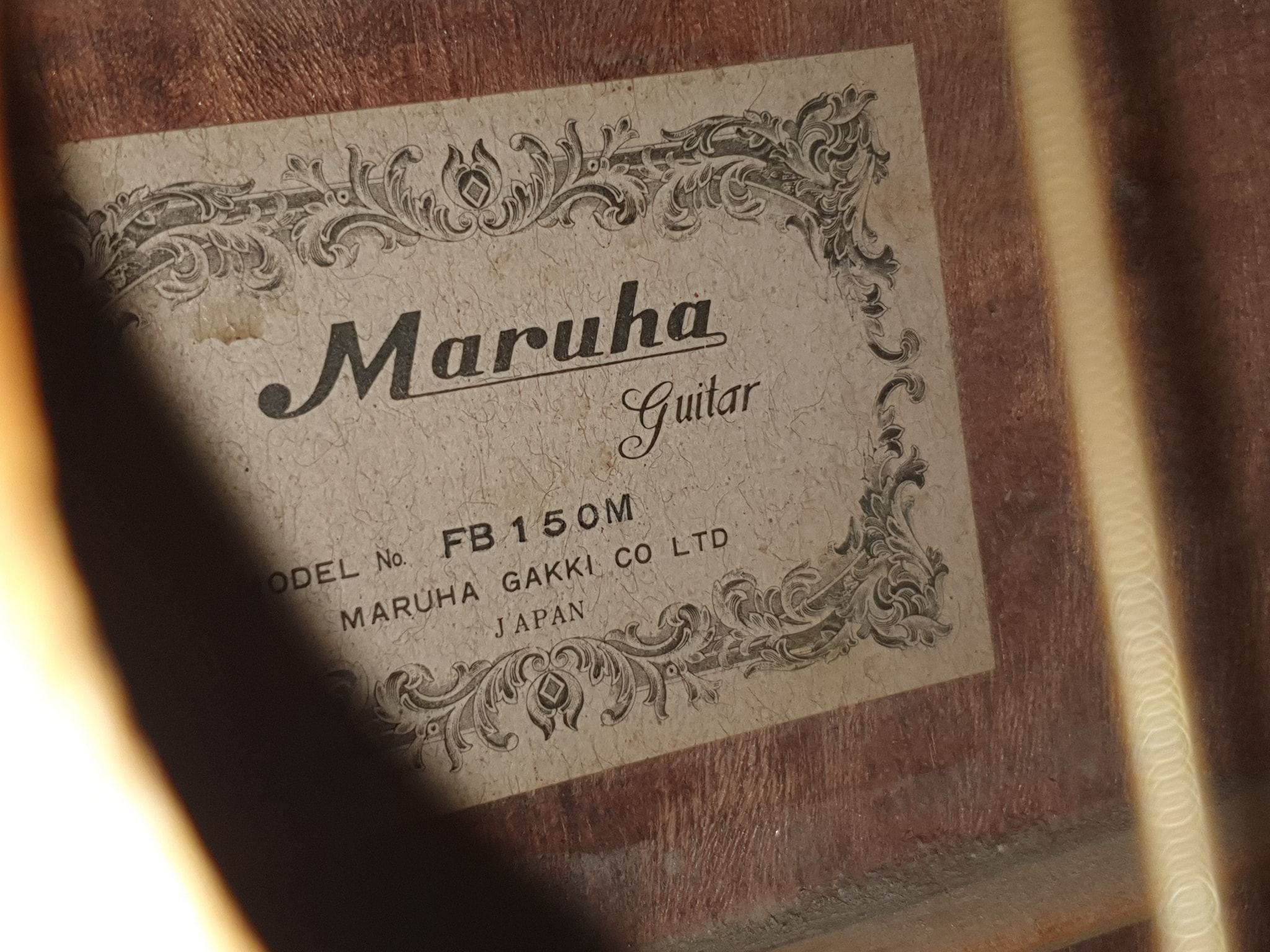 What is the history of Maruha FB150M acoustic guitars?