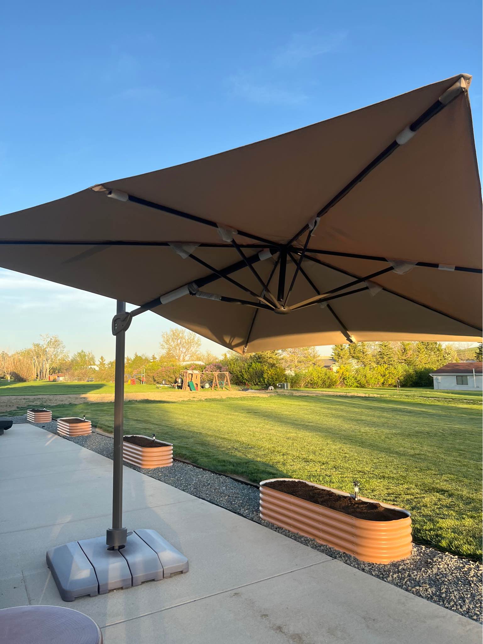 10x13 patio umbrella menards Garden Winds Custom Fit Replacement Canopy Top Cover Compatible with The Backyard Creations UMB-952371 10' x 13' Offset duty 525 denier polyester in Beige with a reinforced grid pattern to help reduce tear spread Garden Winds Replacement Canopy Top