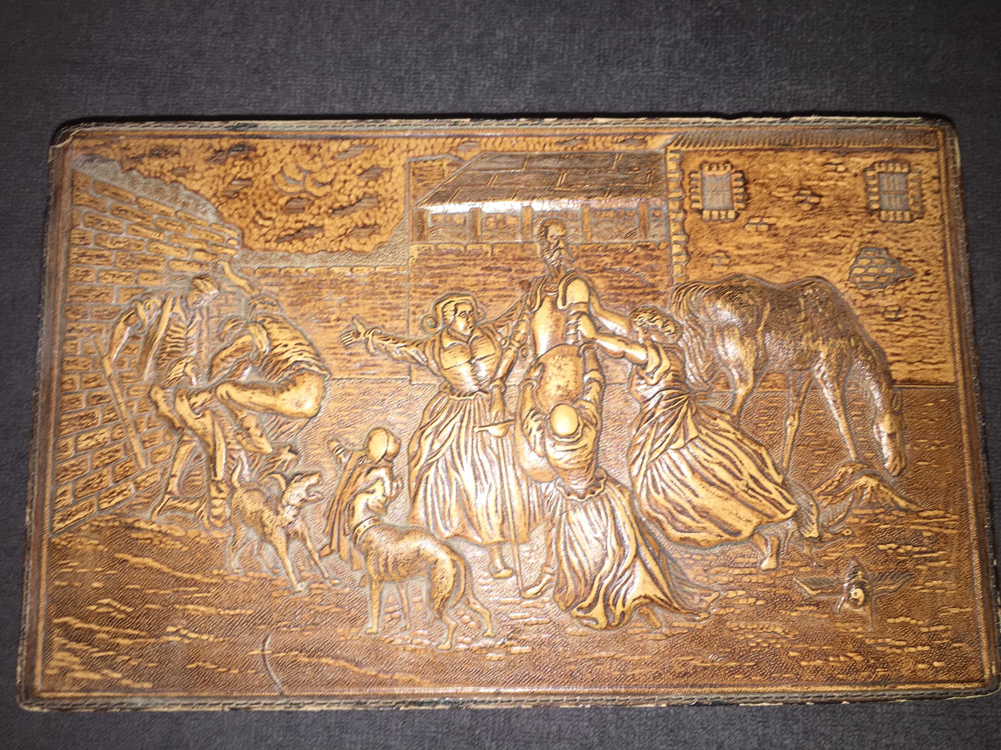 Vintage wooden cigar box is brown with a hinged lid and metal