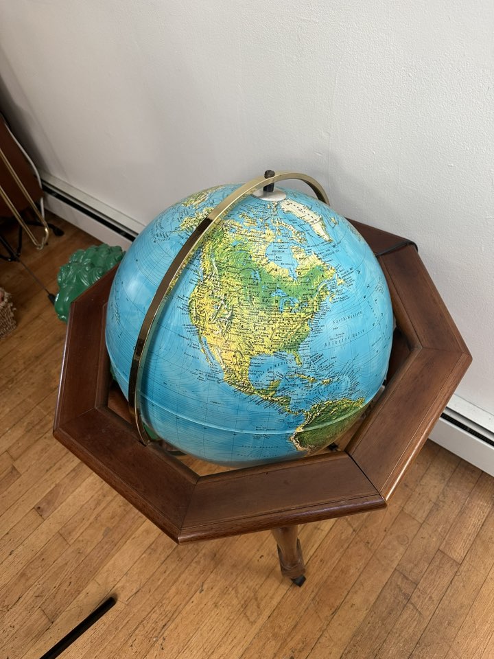 A beautiful and unusual vintage Italian globe, featuring detailed