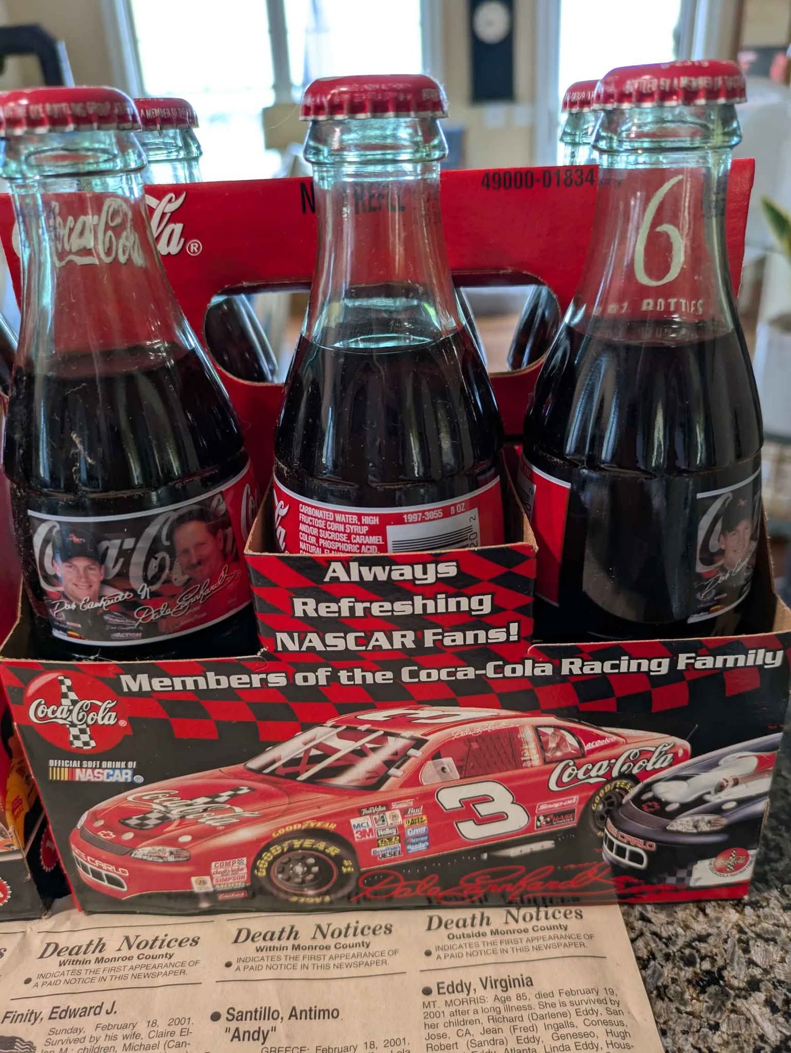 These vintage Coca-Cola NASCAR six pack 8 oz bottles featuring 