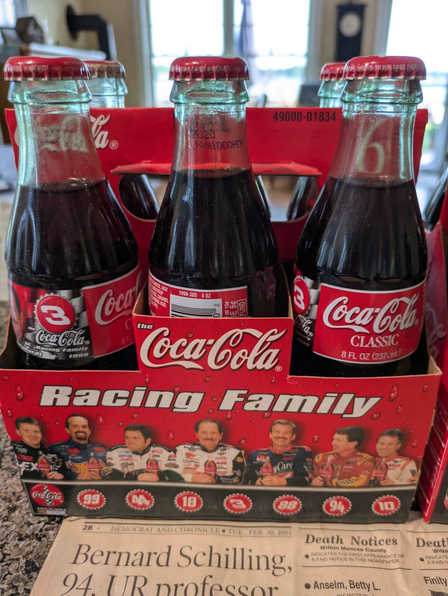 These vintage Coca-Cola NASCAR six pack 8 oz bottles featuring 