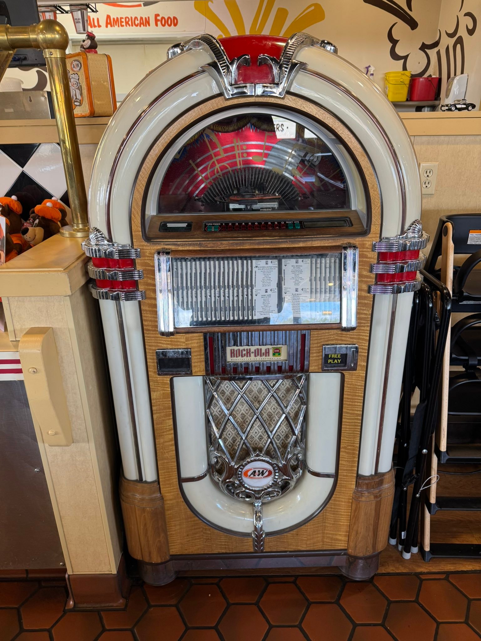 A&W collectibles for sale: jukebox and Rooty statue