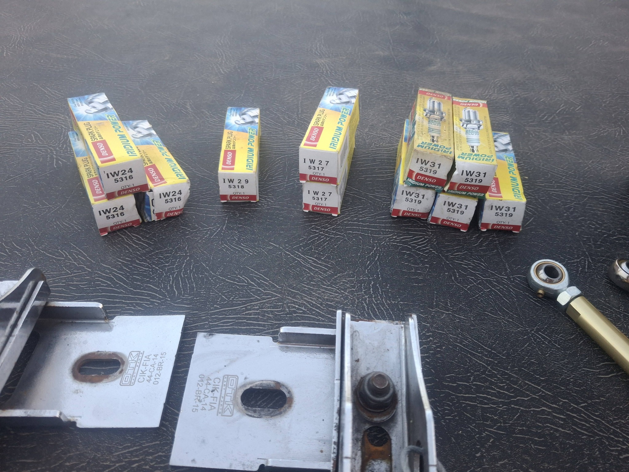 Brand New Denso Spark Plugs, Silkolene Oil, and Motorcycle Parts