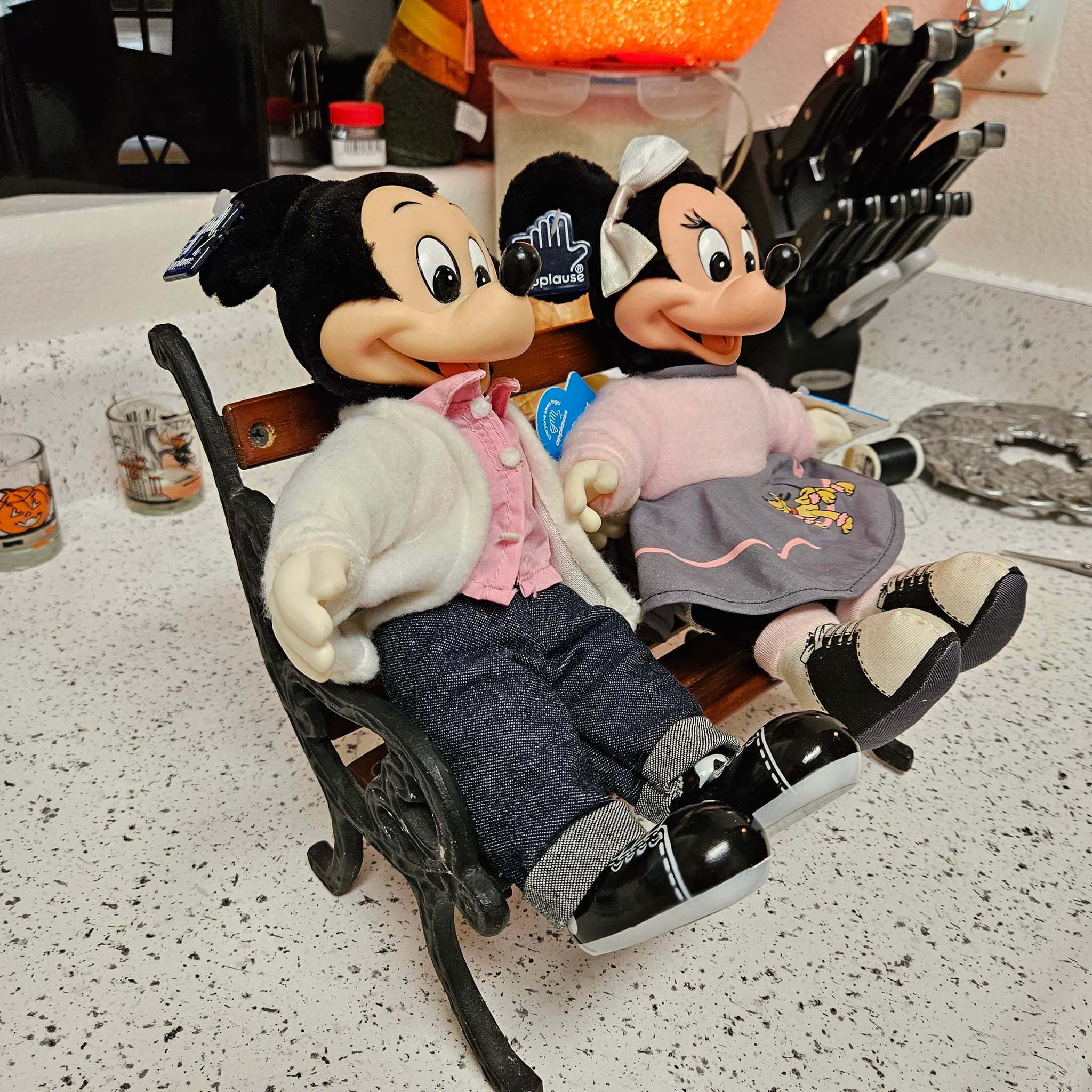 Vintage Mickey and Minnie dolls paired with tiny park bench