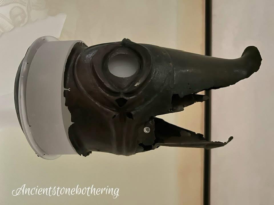 A Carnyx, an Iron Age war trumpet found buried in a peat bog, and