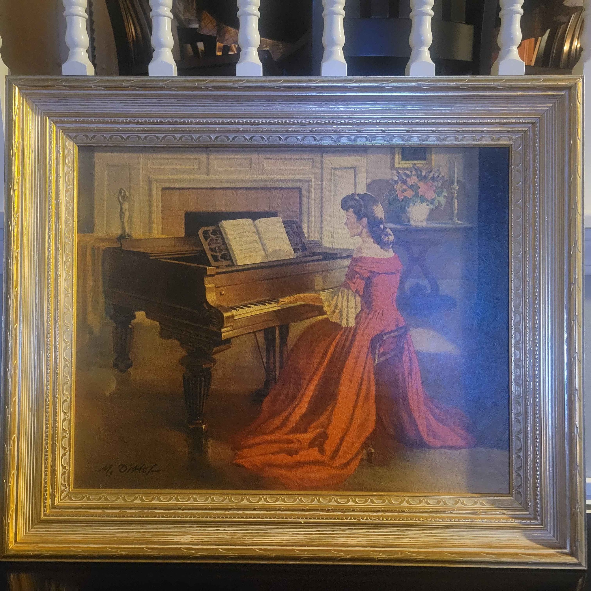lady in red dress playing piano painting Beautiful of a woman a a grand piano. It has a classic vibe with an ornate gold frame. Signature is M. Didek antique painting of woman playing piano