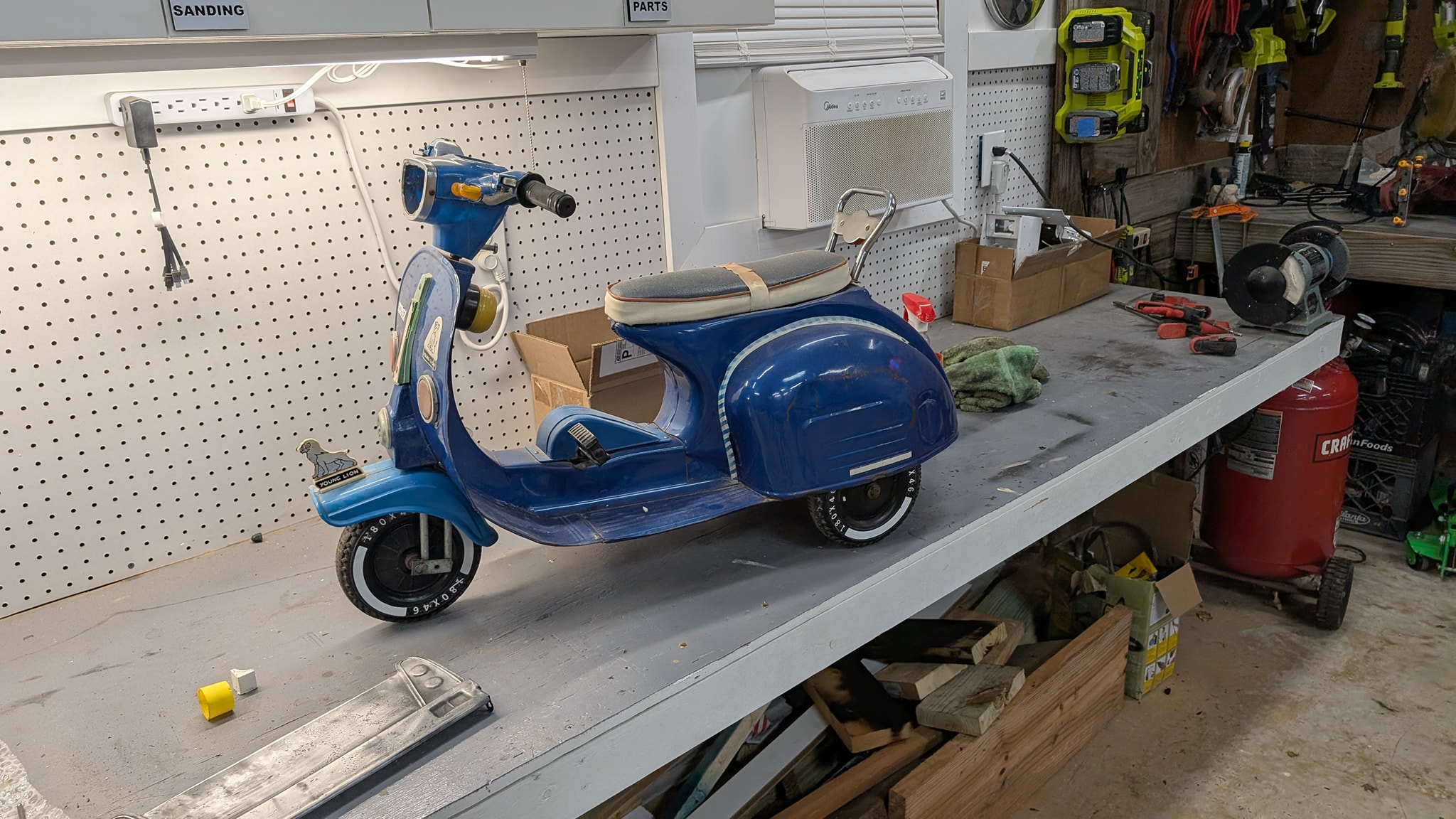 Restoring 1960s young lion pedal scooter