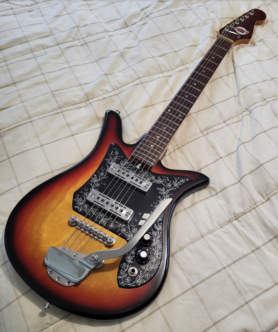 What is the difference between Teisco ET-200 and ET-200N guitars?