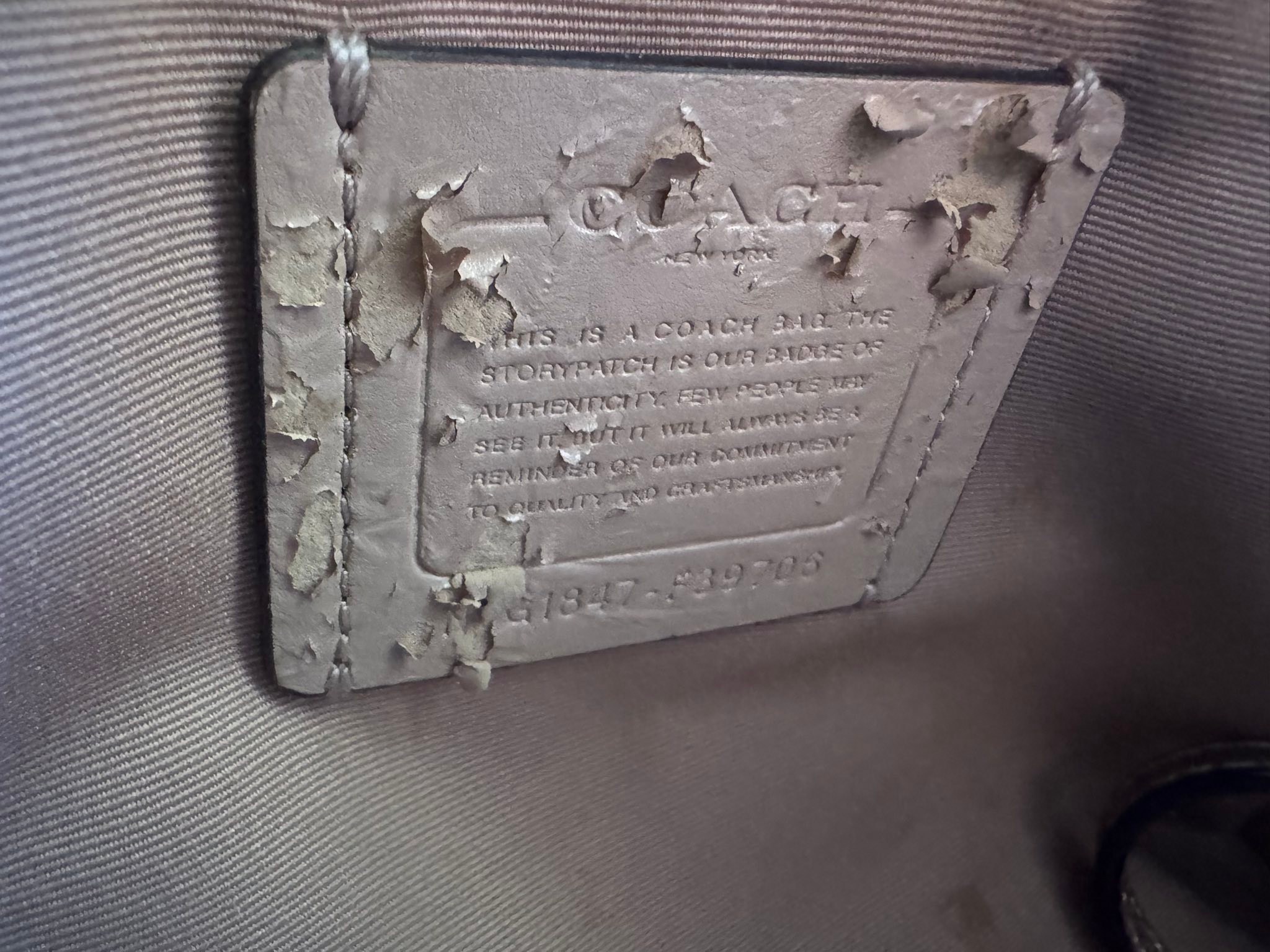 Coach tag peeling off?