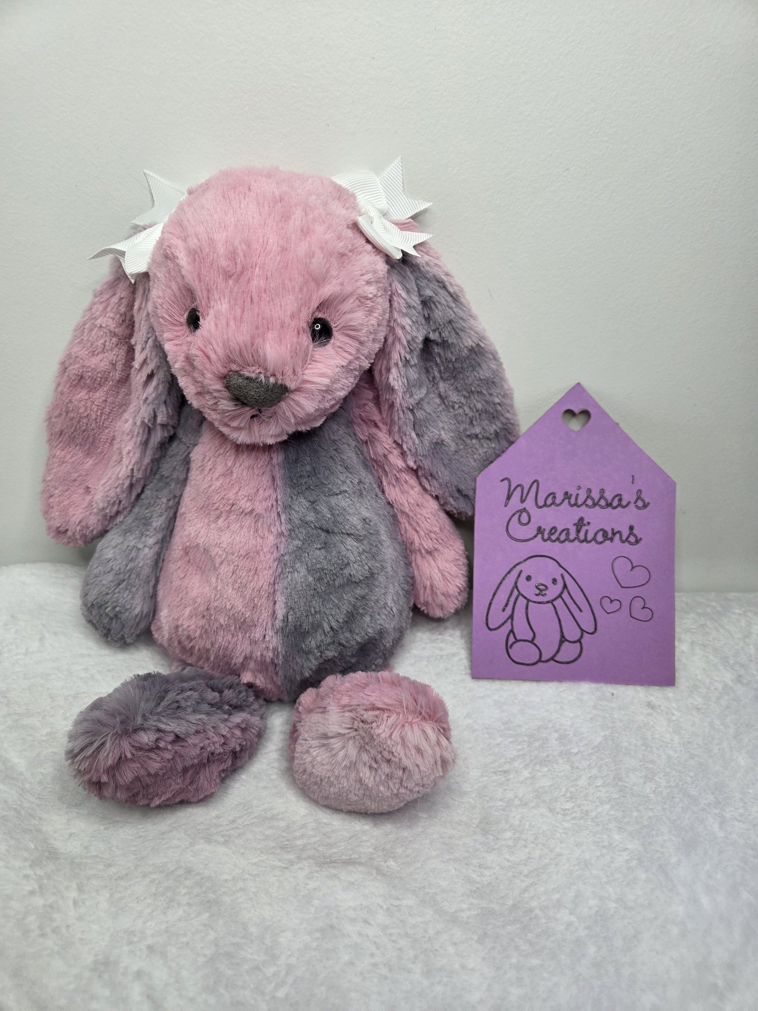 Cerise Jellycat Bashful bunny. Show here embroidered in pink and