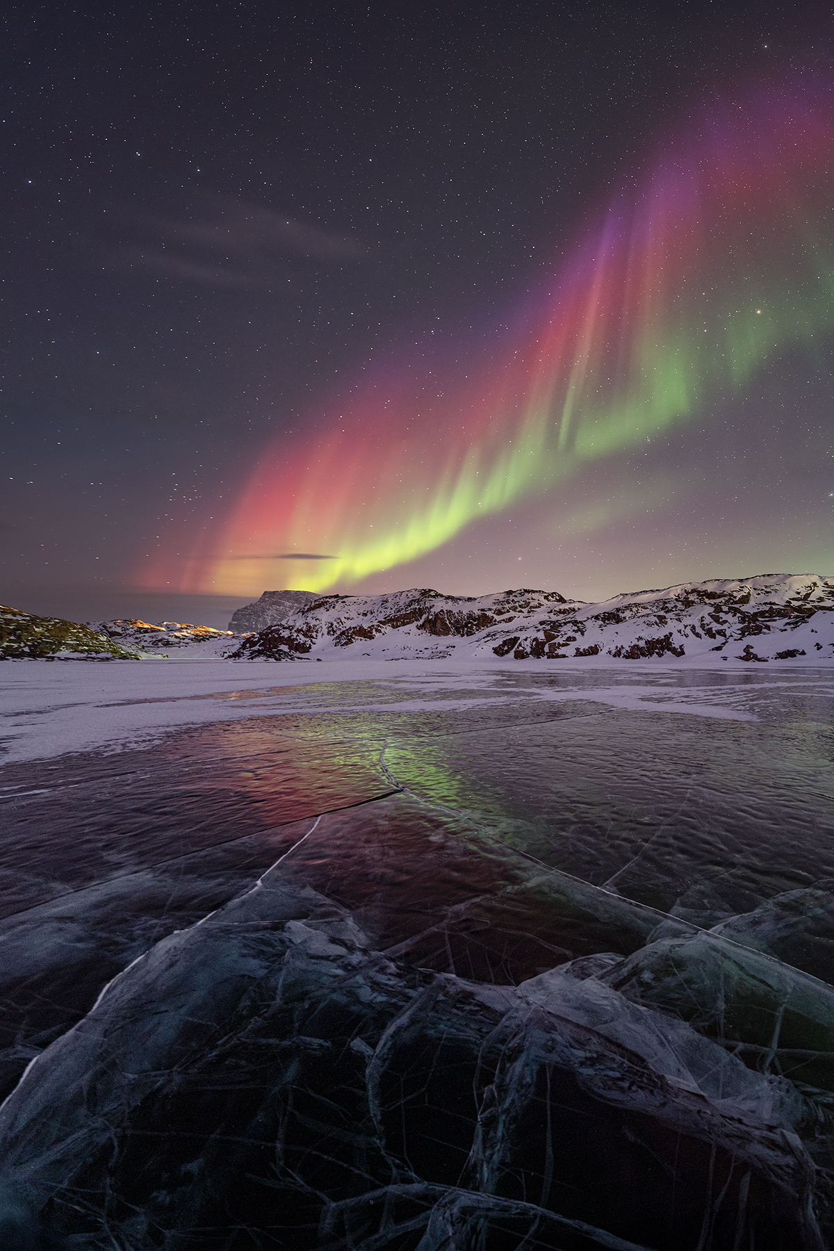 Northern Lights over frozen lake in Northern Greenland