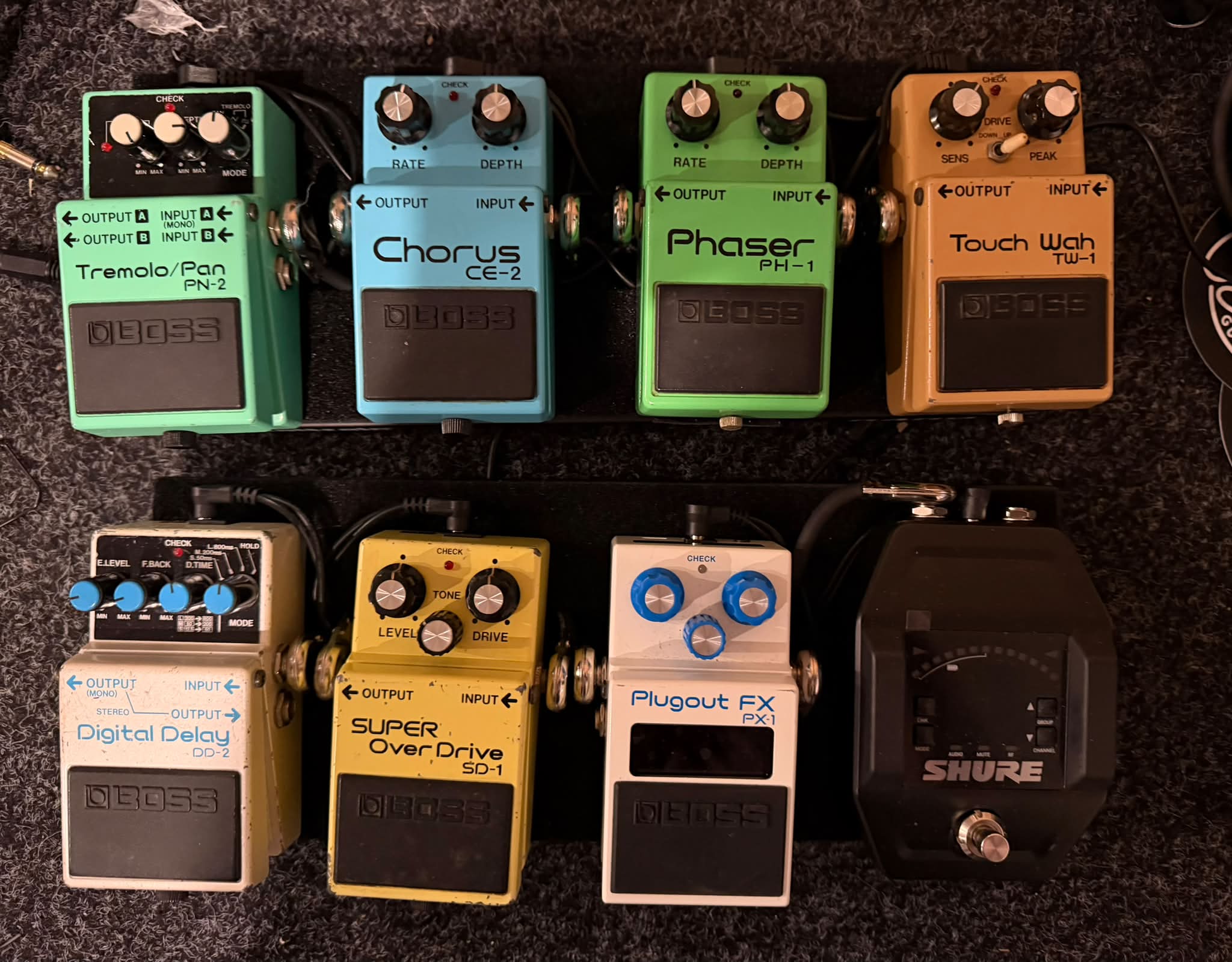 Vintage pedal collection including Boss CS-2 and EHX Black Finger
