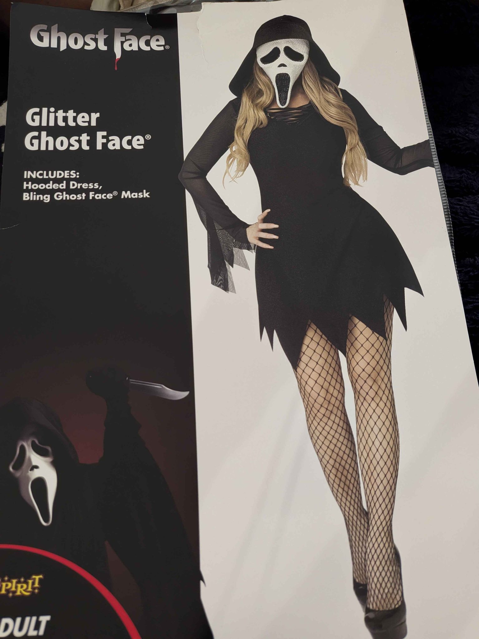 glitter ghost face dress Authentic Spirit Halloween adult costume. This set includes a black hooded and a white and black bling Ghost Face mask covered in decorative studs. The costume is an eoysale1226-UPDATE