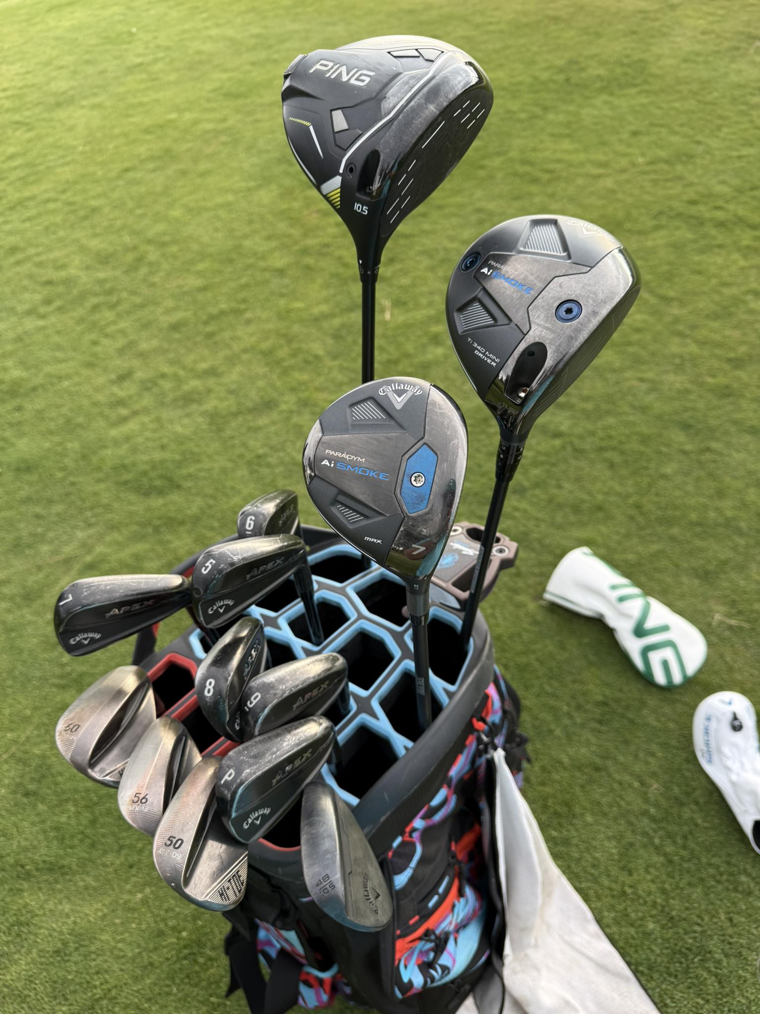 Golfer's bag with PXG 0211 driver and Callaway clubs