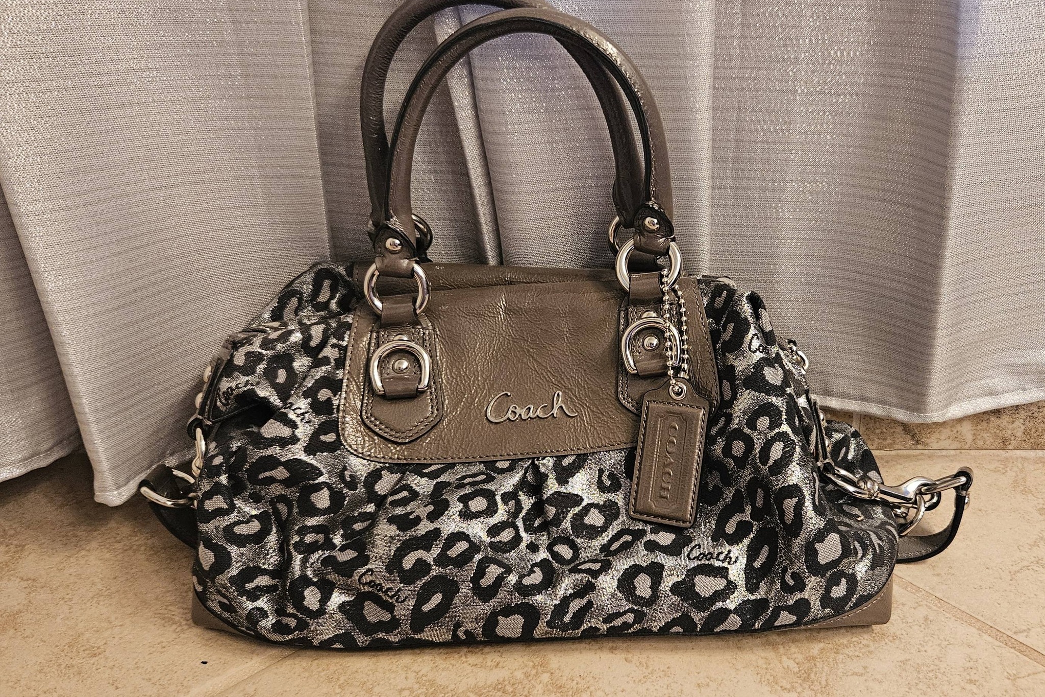 Rare Coach handbags, including kimono and ocelot prints, showcased