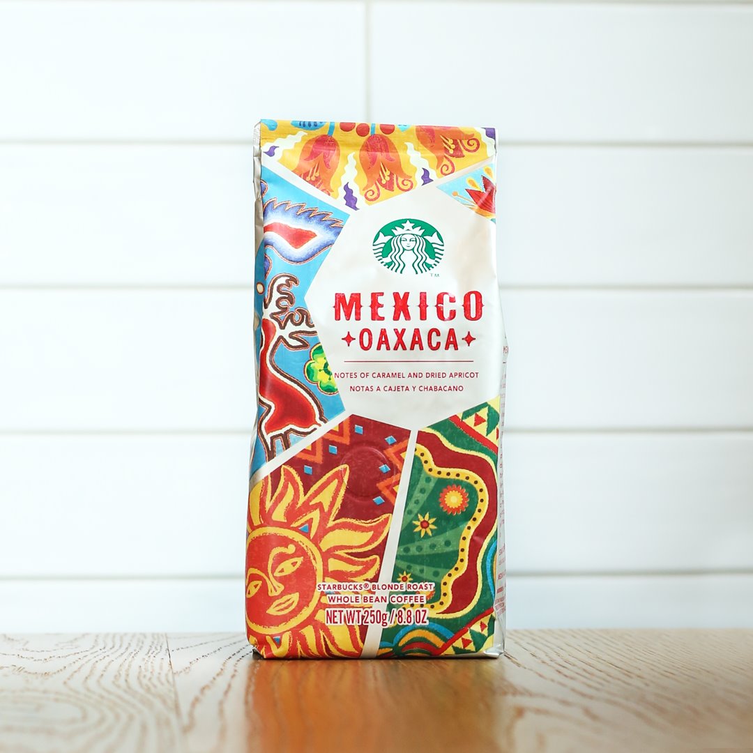 A colorful coffee bag filled with coffee bean flavors of dried
