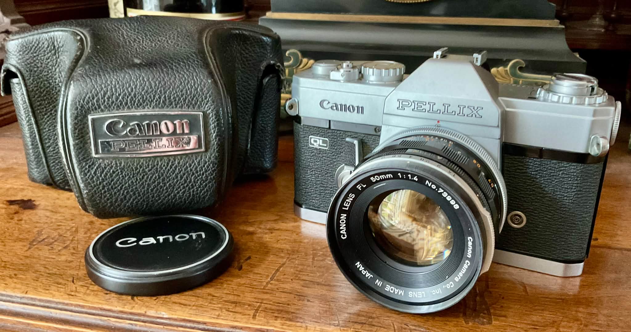 Vintage Canon Pellix QL 35mm SLR camera with Canon FL 50mm f1.4 lens