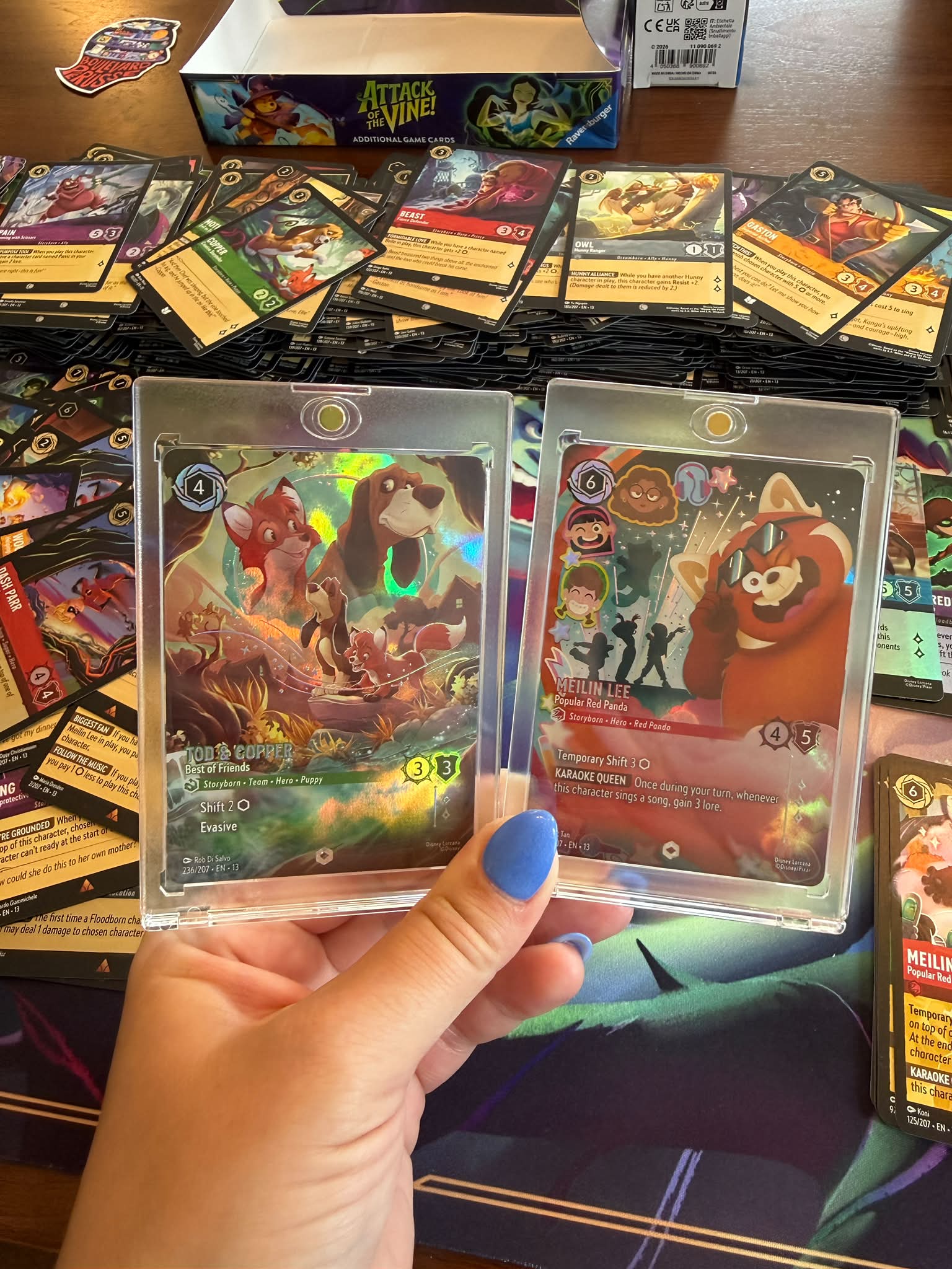 Disney Lorcana player pulls two enchanted cards, Tod & Copper and
