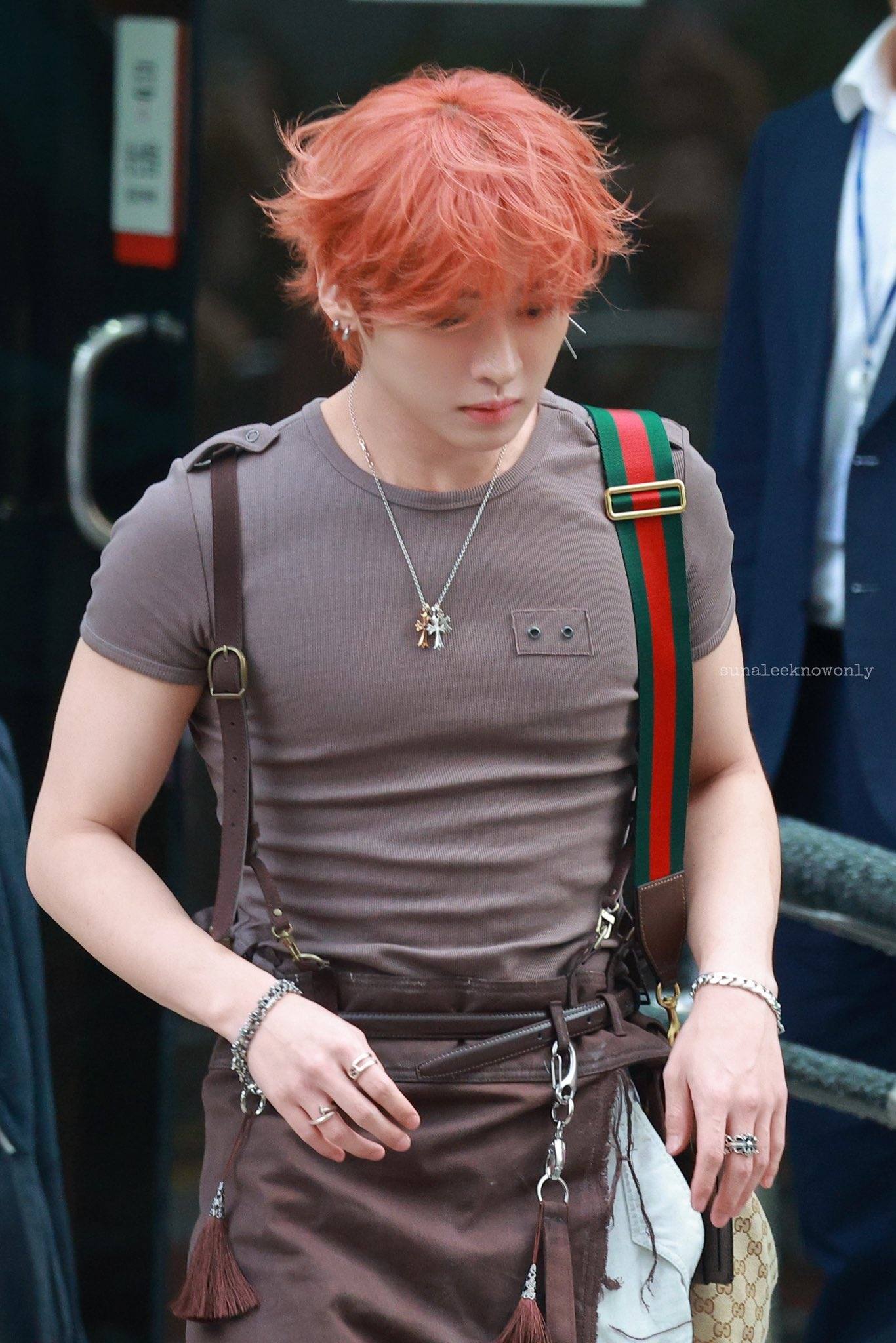 Stray Kids member with orange hair and Gucci strap spotted