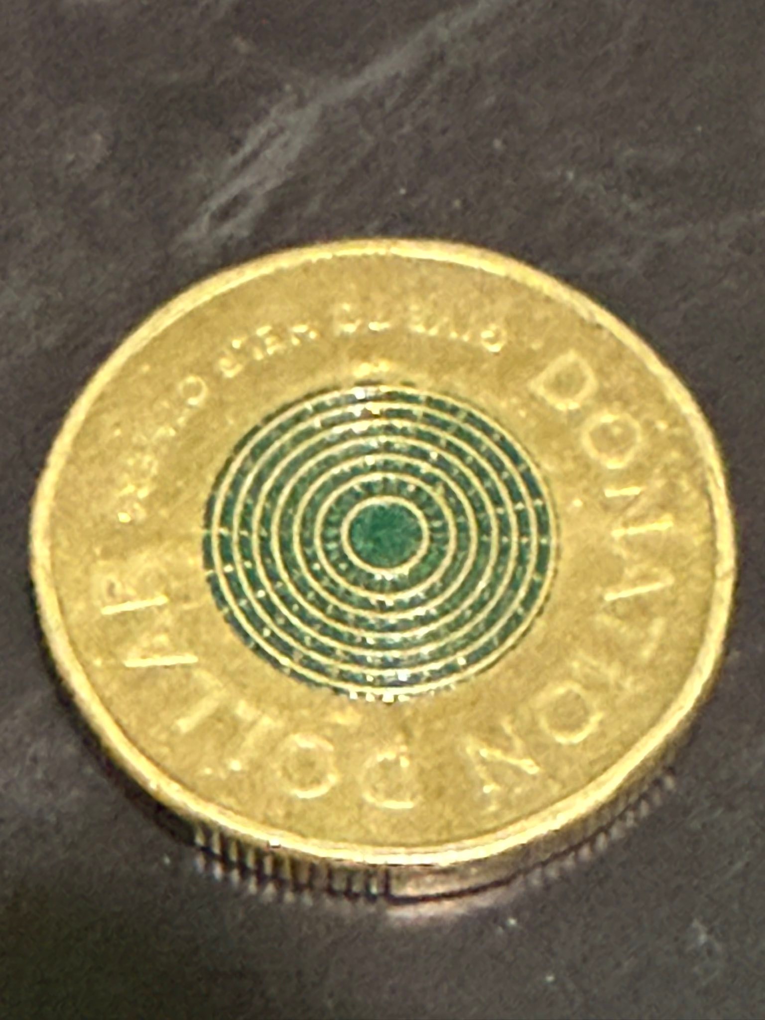 What is the value of this gold coin with JC initials?