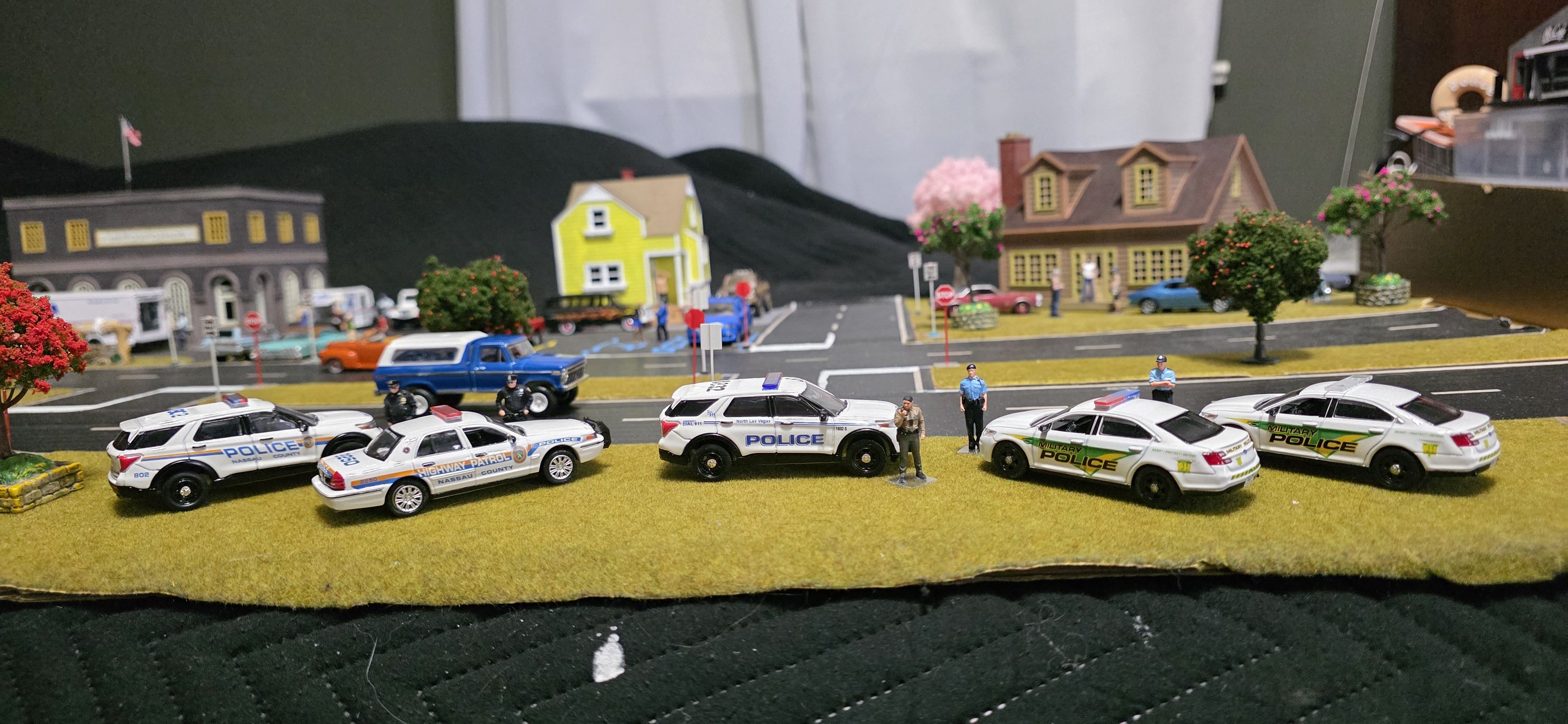 Custom police cars in 1/64 scale, various departments