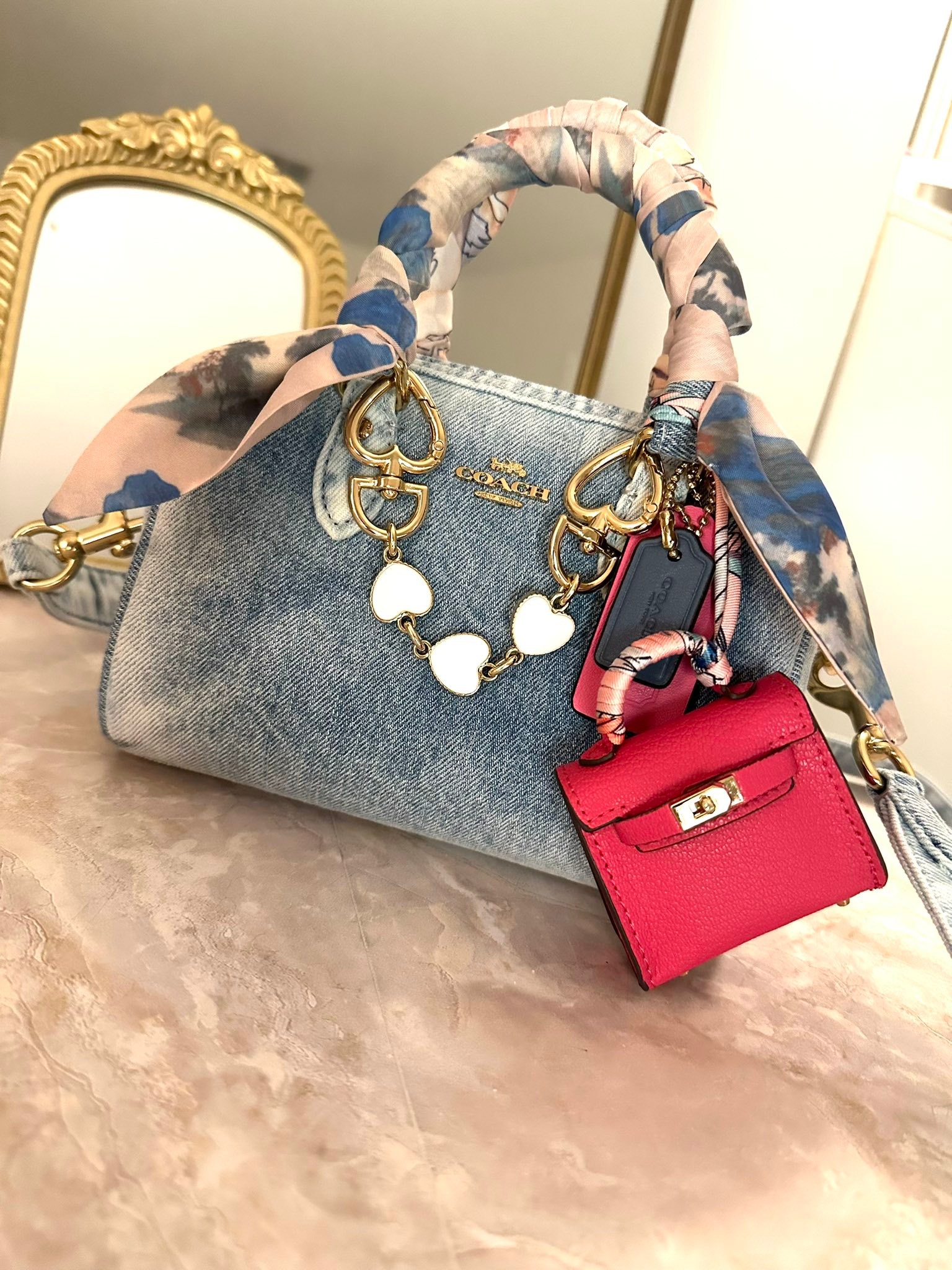 Personalizing coach denim rowan bags with accessories