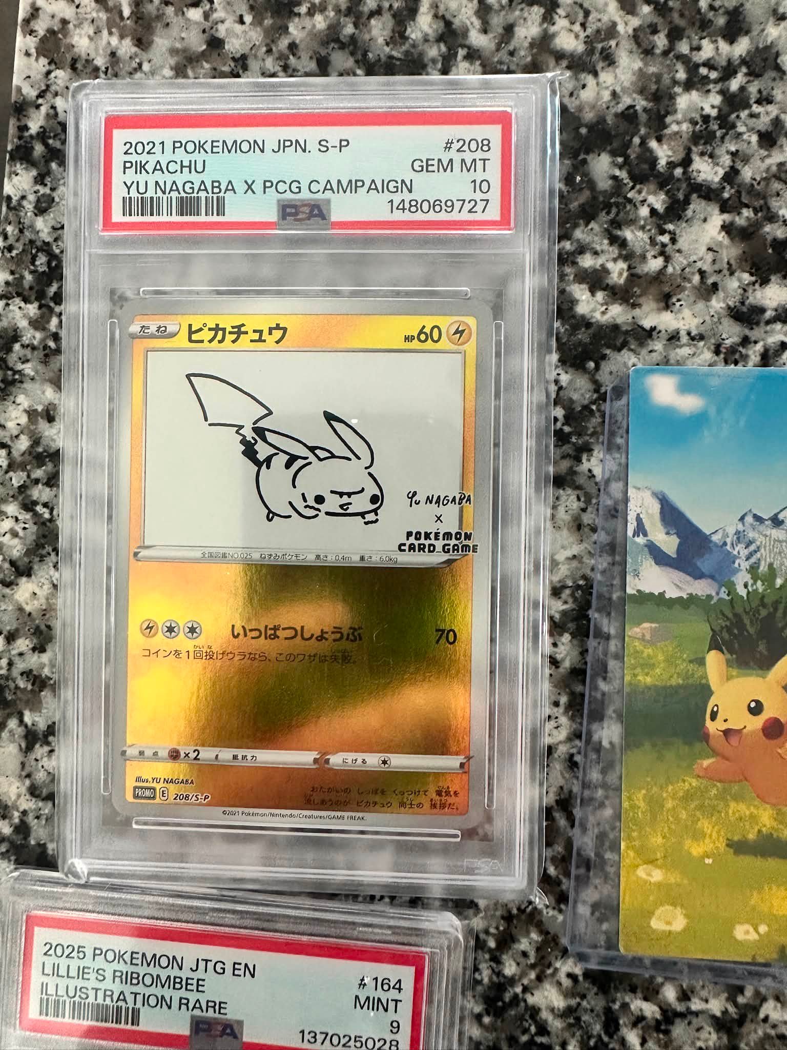 Lucky pulls of PSA 9 Pikachu ex from Pokémon WCS23 Japanese set