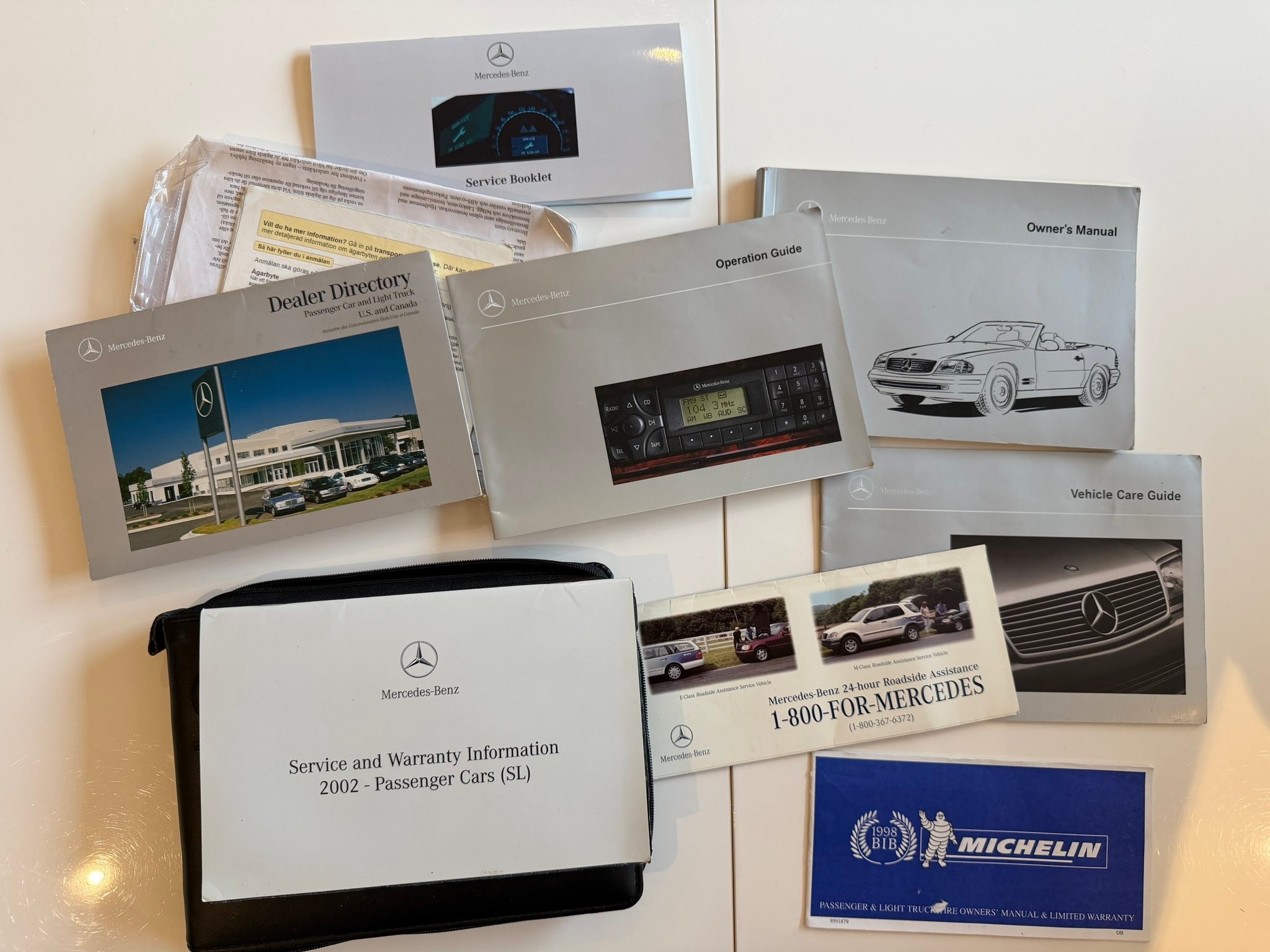 What is a Mercedes service log book for a 2002 car?