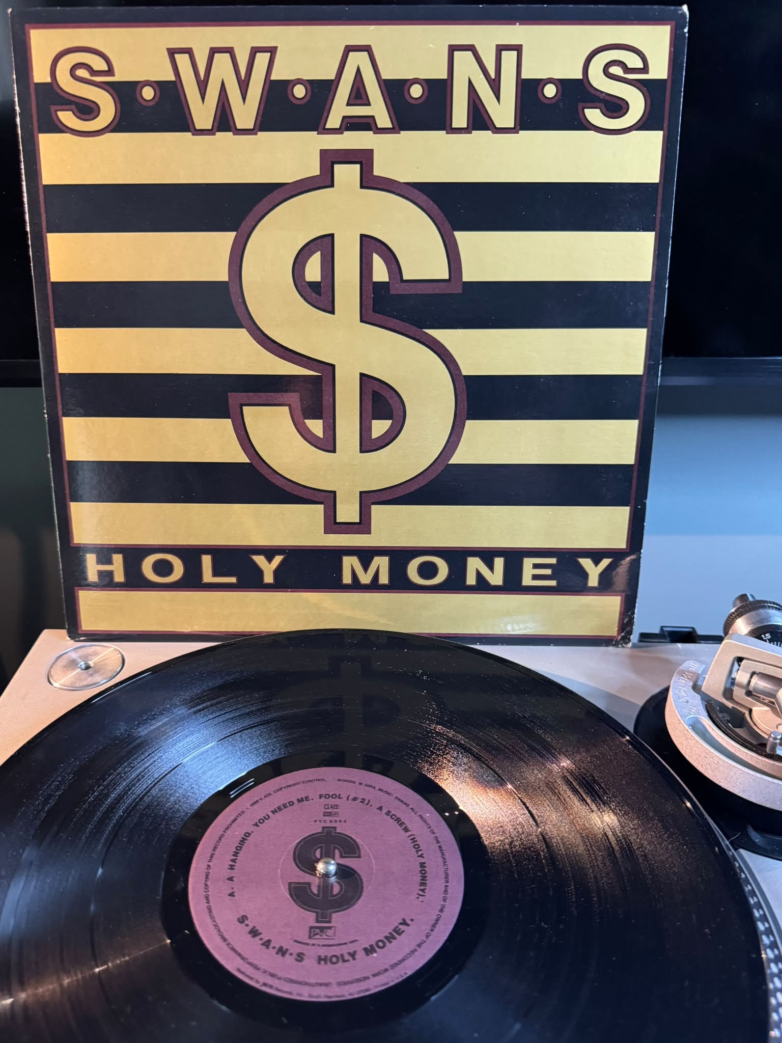 Swans - Holy Money on PVC Records. S.W.A·N·S S S S.W A $ HOLY
