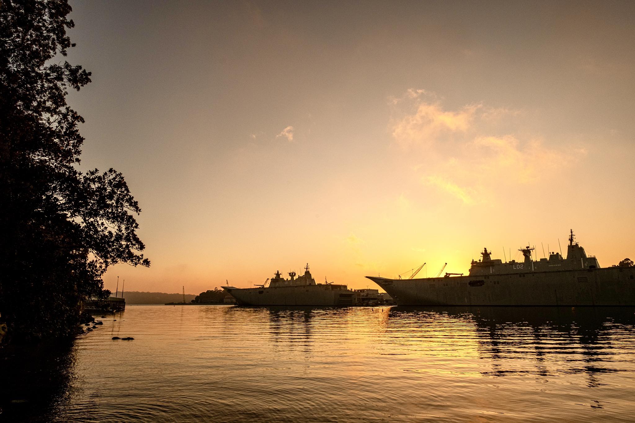 Sydney harbour warships sunrise view