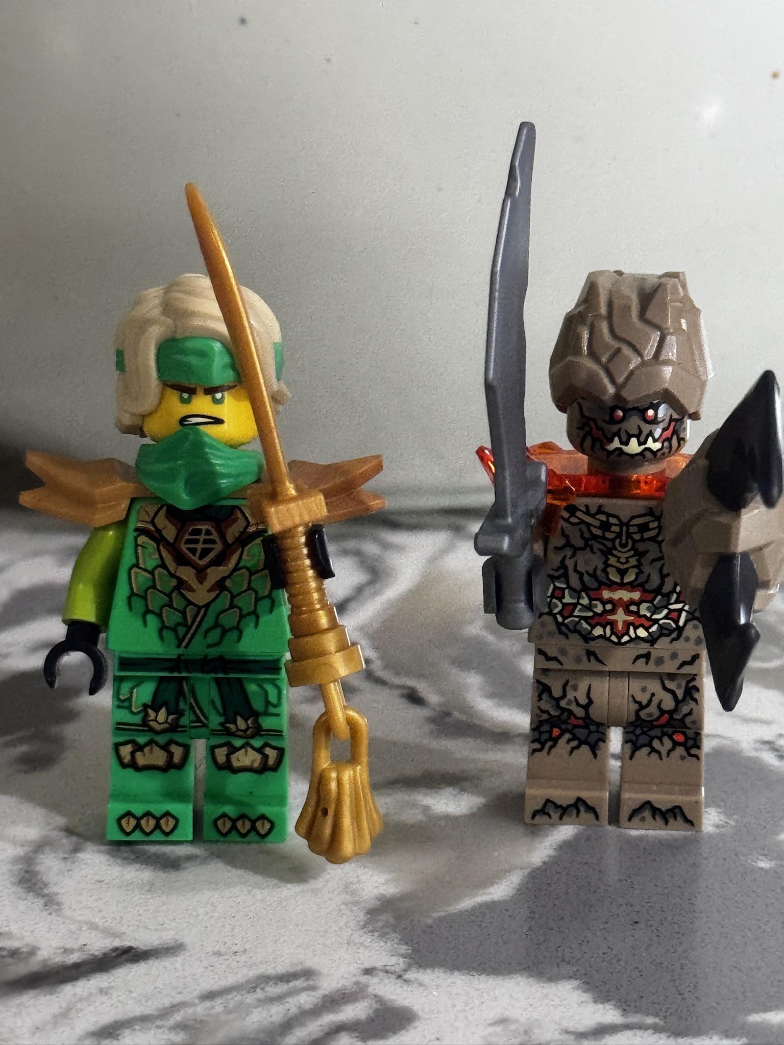アース Lego Ninjago minifigs which include Sora, Kai, and Earth monster