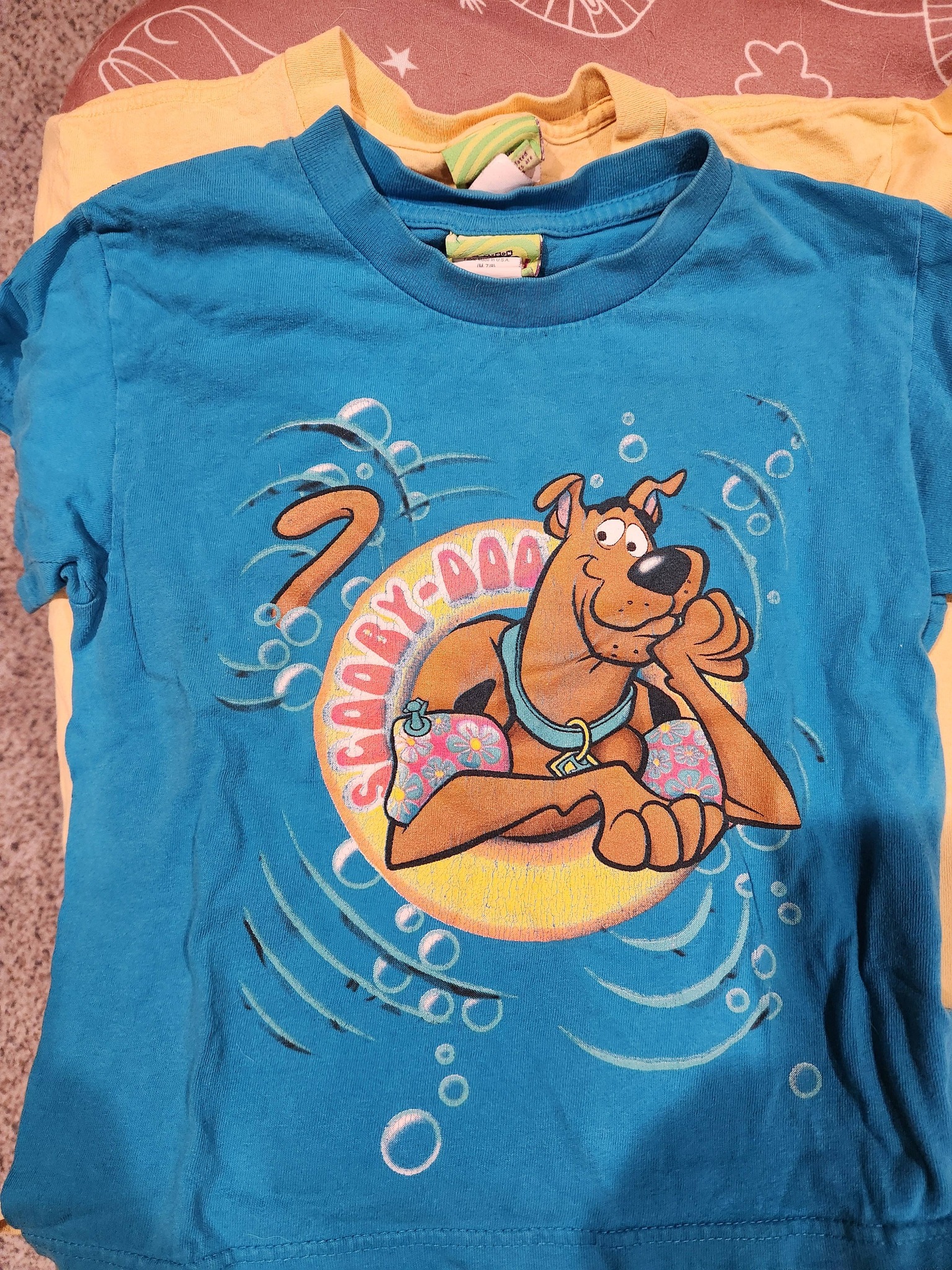 Scooby Doo fan keeps childhood shirts at 32