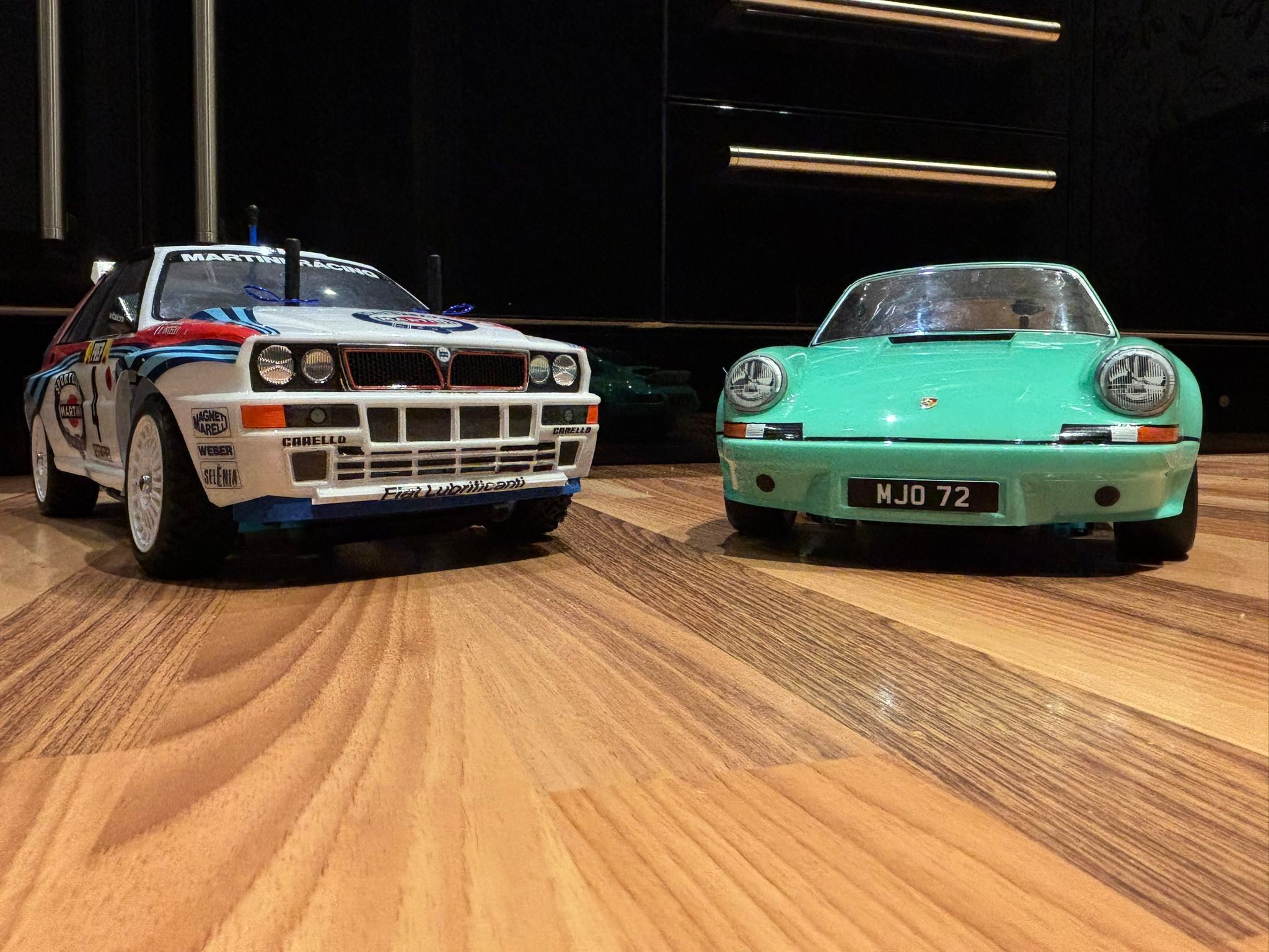 Tamiya TT-02 models: Lancia Delta S4 and Porsche 911 RSR builds