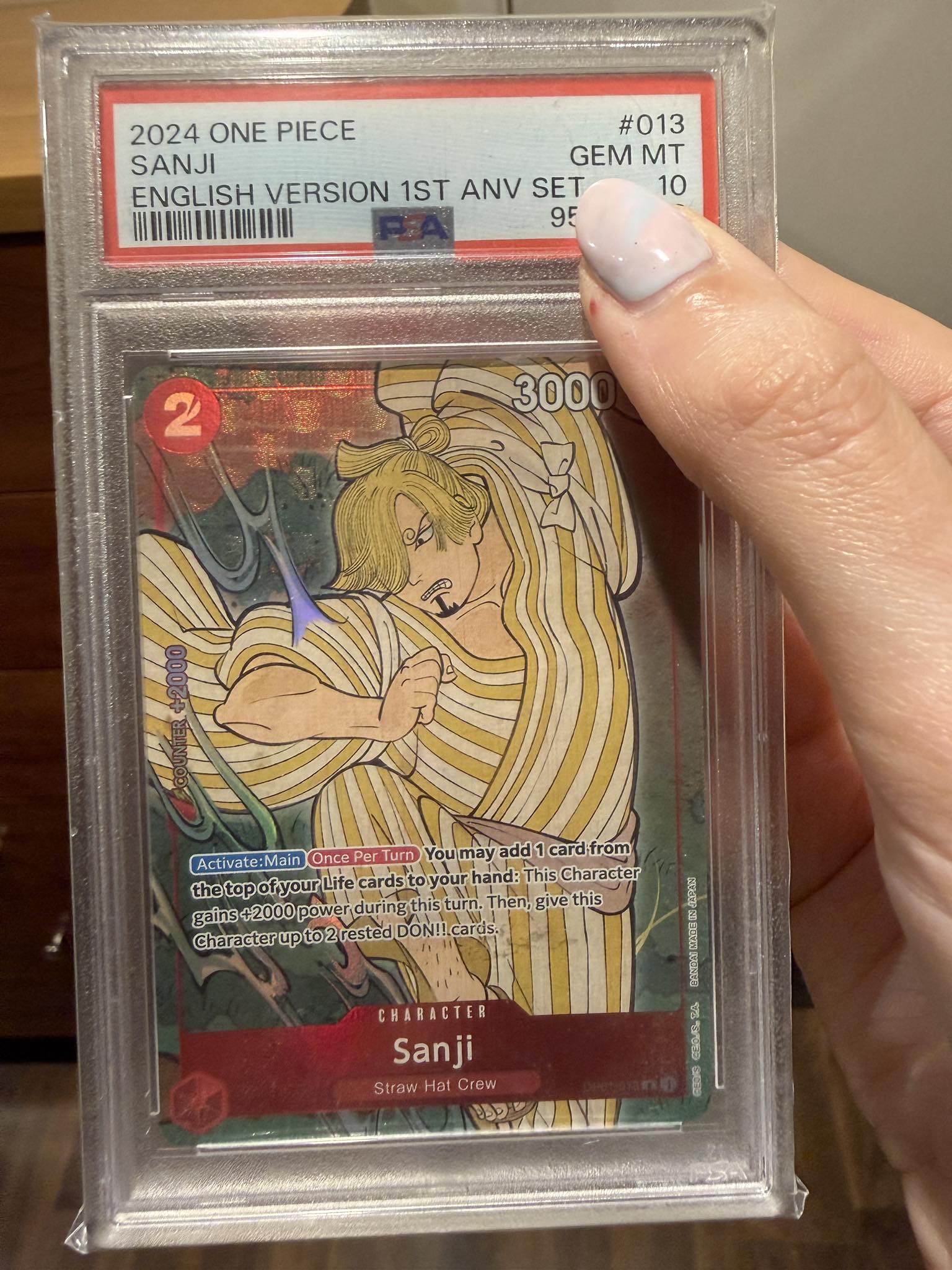 What is the value of a PSA 10 Sanji anniversary card?