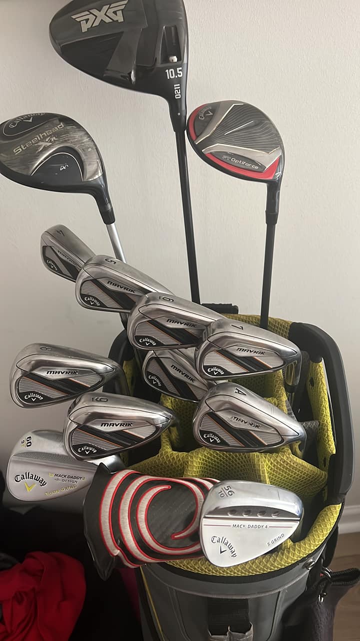 Golfer's bag with PXG 0211 driver and Callaway clubs